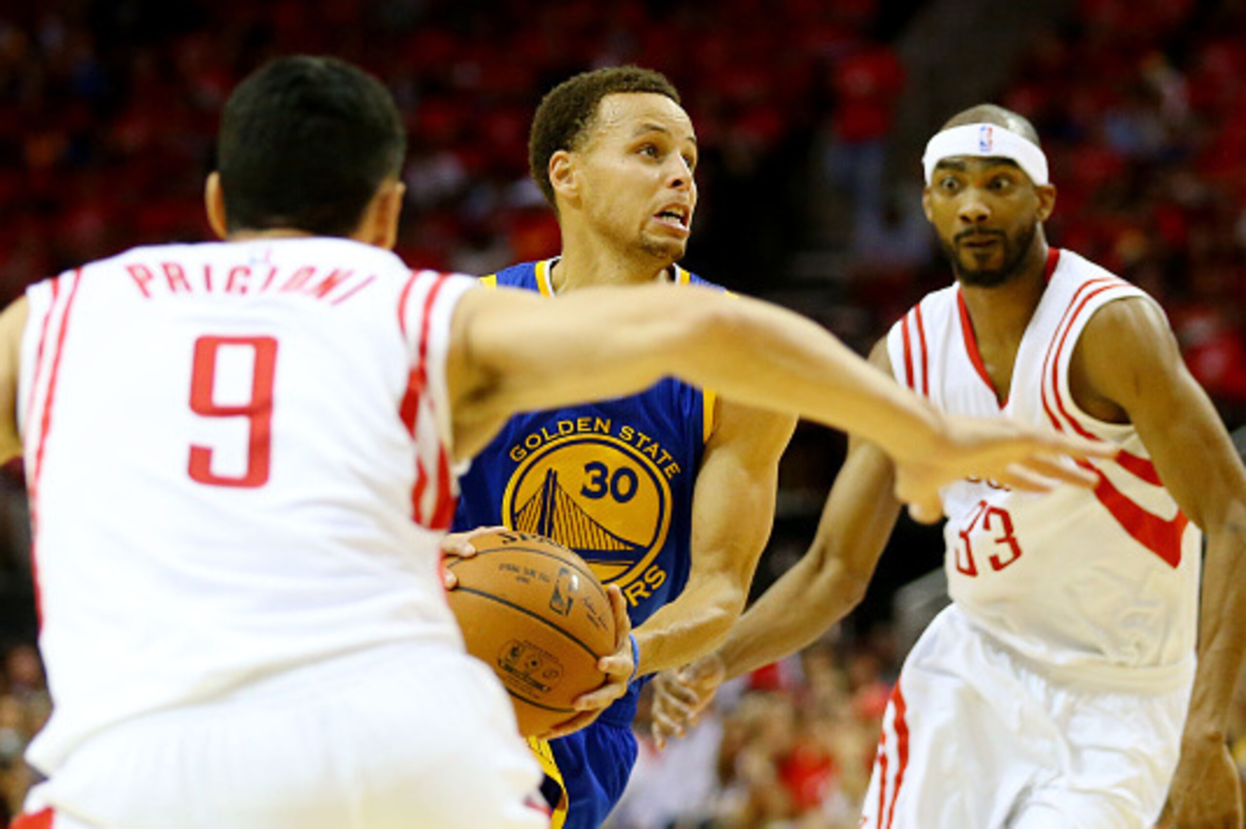 HOUSTON, TX - MAY 25:  Stephen Curry #30 of the Golden State Warriors drives against Corey Brewer #33 and Pablo Prigioni #9 of the Houston Rockets in the third quarter during Game Four of the Western Conference Finals of the 2015 NBA Playoffs at Toyota Ce