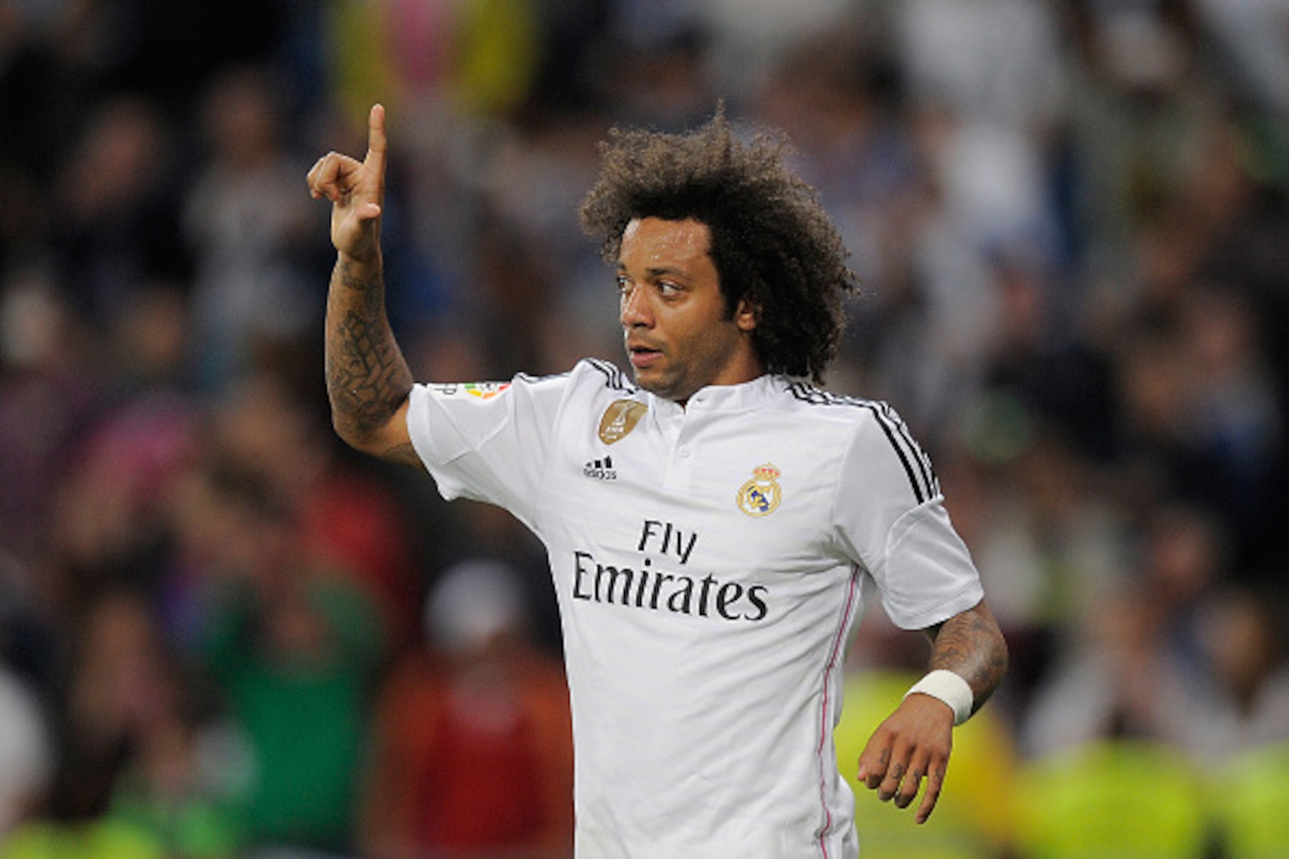 MADRID, SPAIN - MAY 23:  Marcelo of Real Madrid celebrates after scoring his team's 7th goal during the La Liga match between Real Madrid CF and Getafe CF at Estadio Santiago Bernabeu on May 23, 2015 in Madrid, Spain.  (Photo by Denis Doyle/Getty Images)