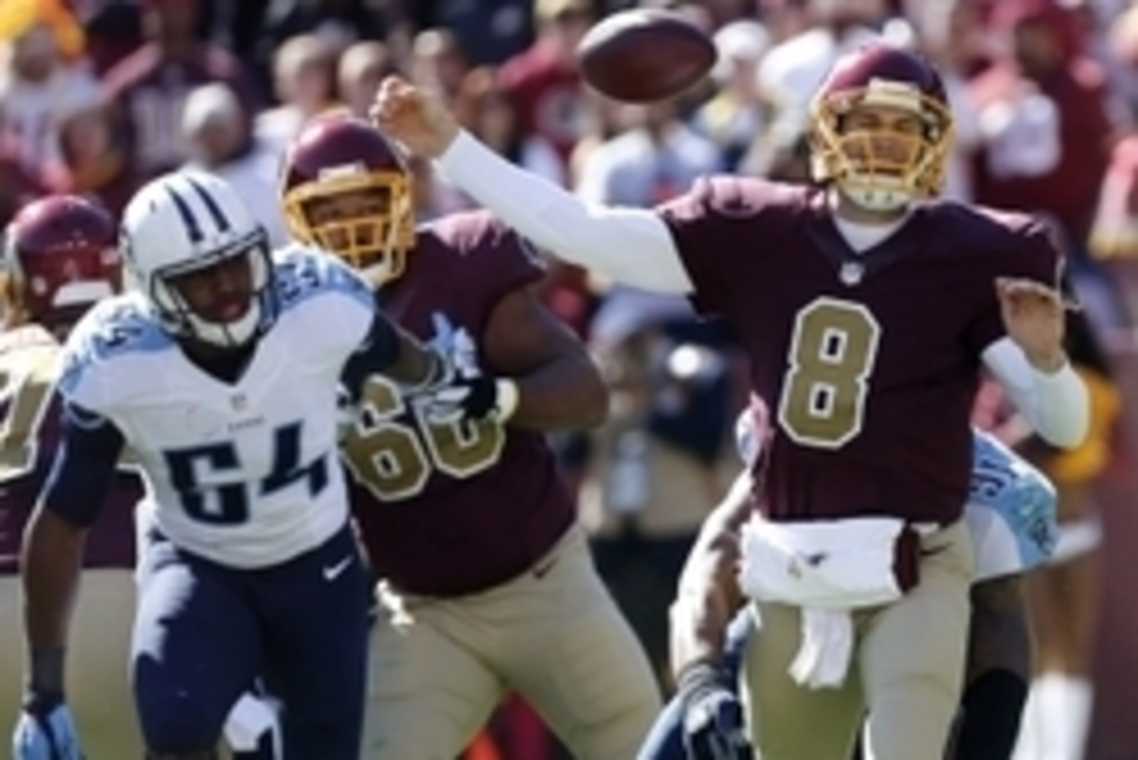 Oct 19, 2014; Landover, MD, USA; Washington Redskins quarterback Kirk Cousins (8) attempts to throw the ball as Tennessee Titans outside linebacker Derrick Morgan (91) tackles him in the first quarter at FedEx Field. Mandatory Credit: Geoff Burke-USA TODA