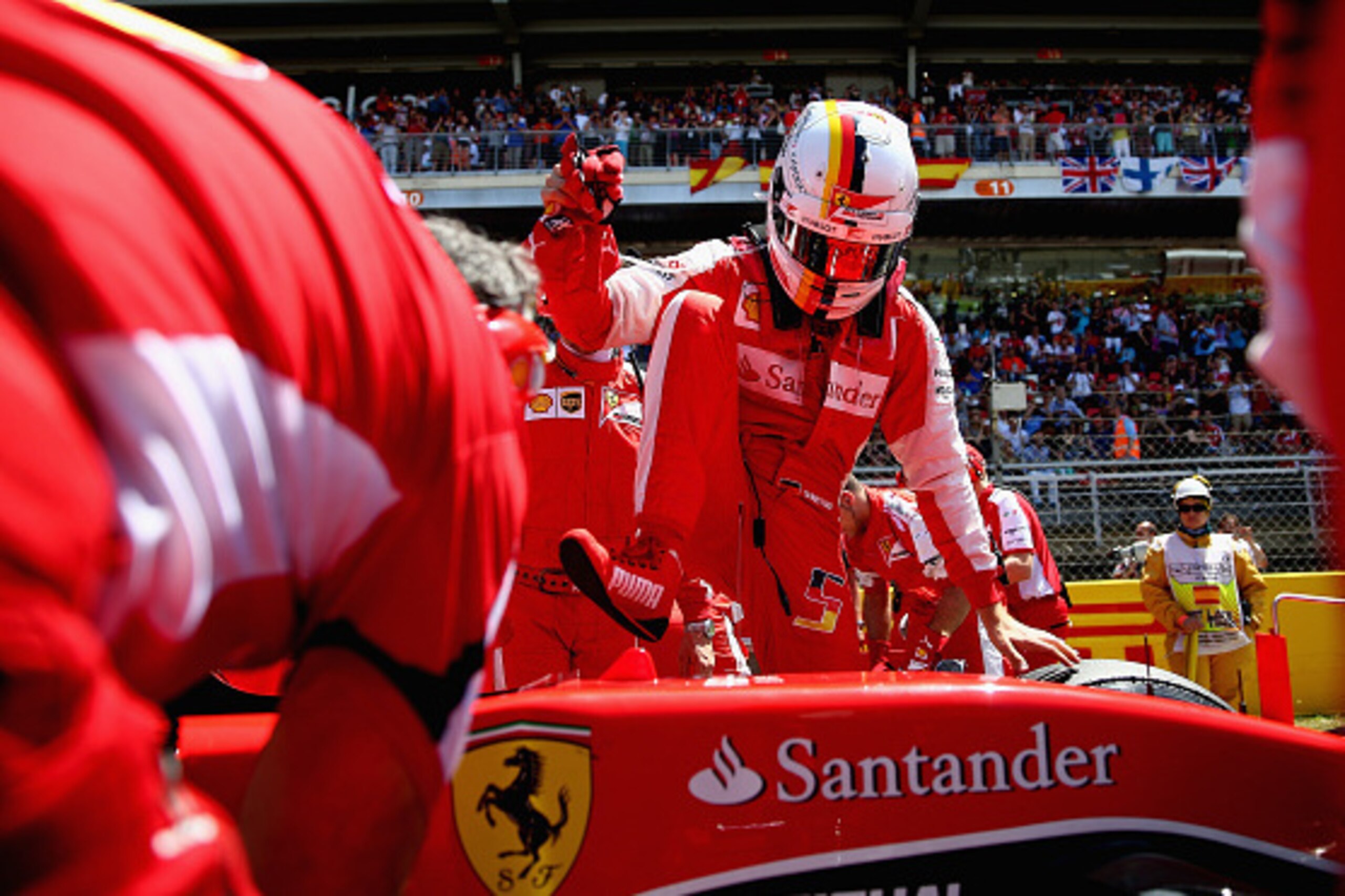 MONTMELO, SPAIN - MAY 10:  Sebastian Vettel of Germany and Ferrari prepares on the grid before the Spanish Formula One Grand Prix at Circuit de Catalunya on May 10, 2015 in Montmelo, Spain.  (Photo by Clive Mason/Getty Images)