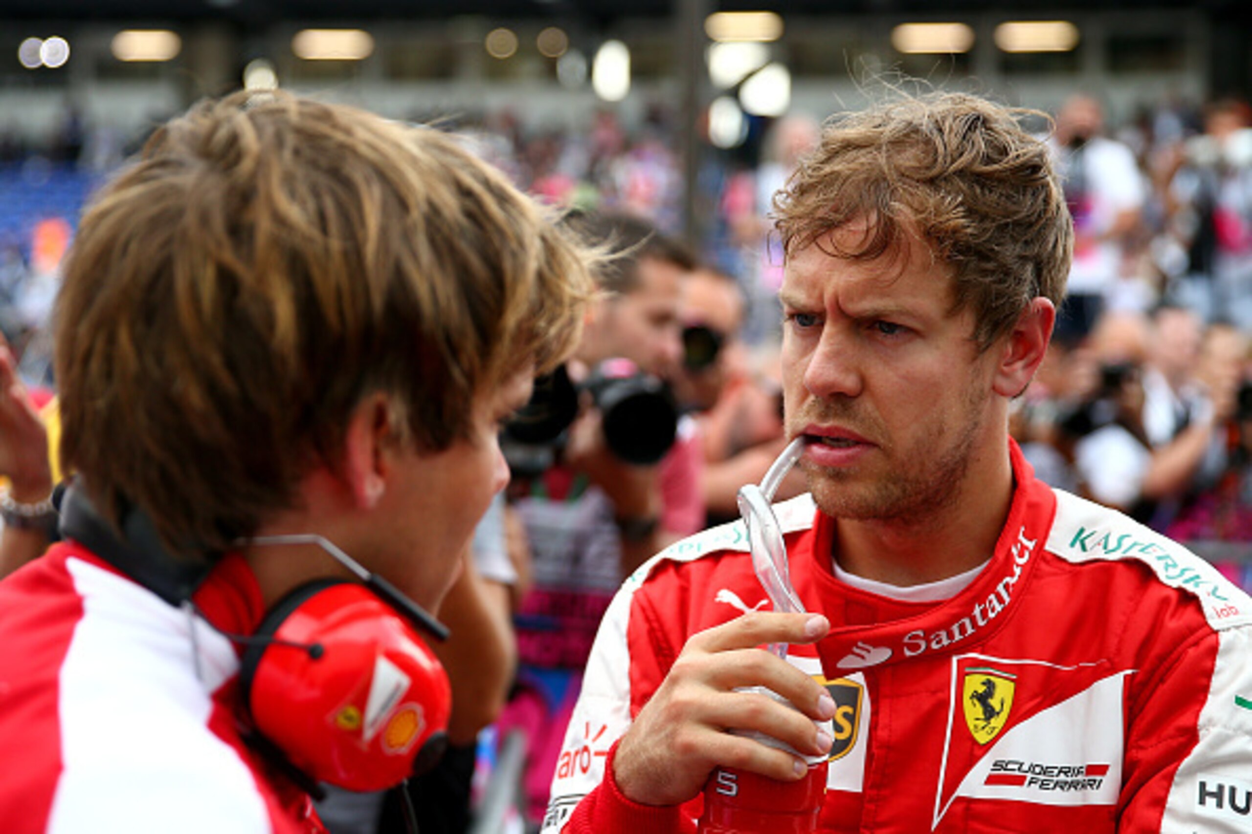 MONTE-CARLO, MONACO - MAY 23:  Sebastian Vettel of Germany and Ferrari speaks with a member of his team in Parc Ferme after claiming third position on the grid during qualifying for the Monaco Formula One Grand Prix at Circuit de Monaco on May 23, 2015 in