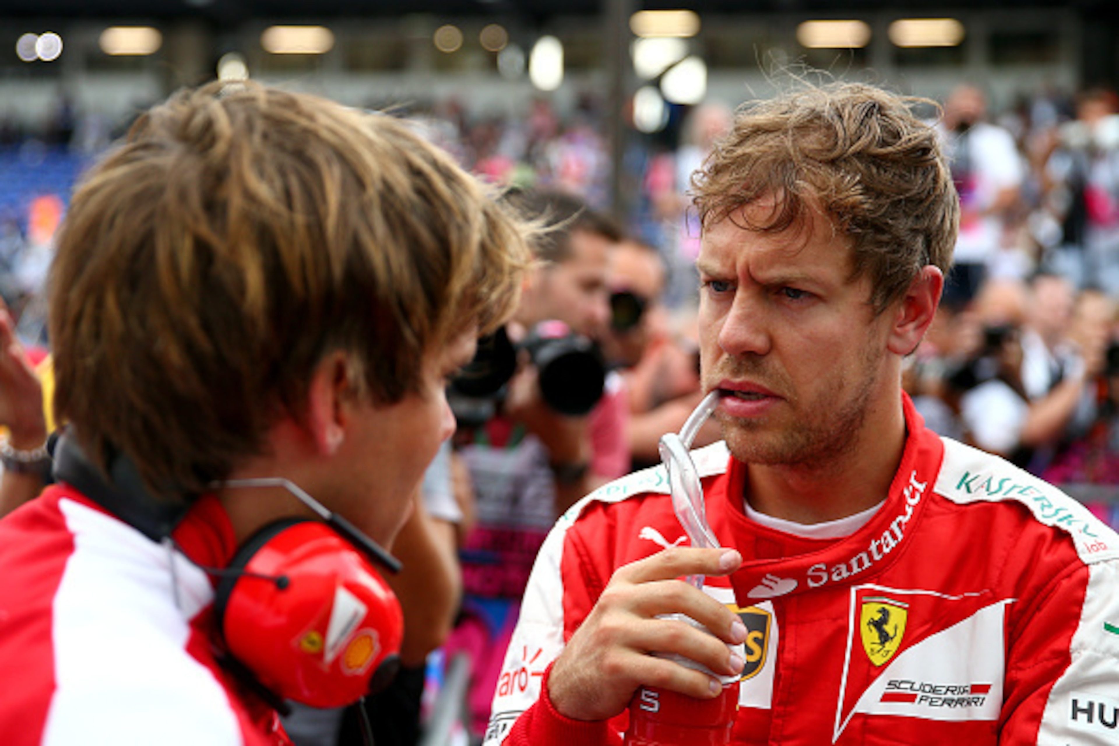 MONTE-CARLO, MONACO - MAY 23:  Sebastian Vettel of Germany and Ferrari speaks with a member of his team in Parc Ferme after claiming third position on the grid during qualifying for the Monaco Formula One Grand Prix at Circuit de Monaco on May 23, 2015 in