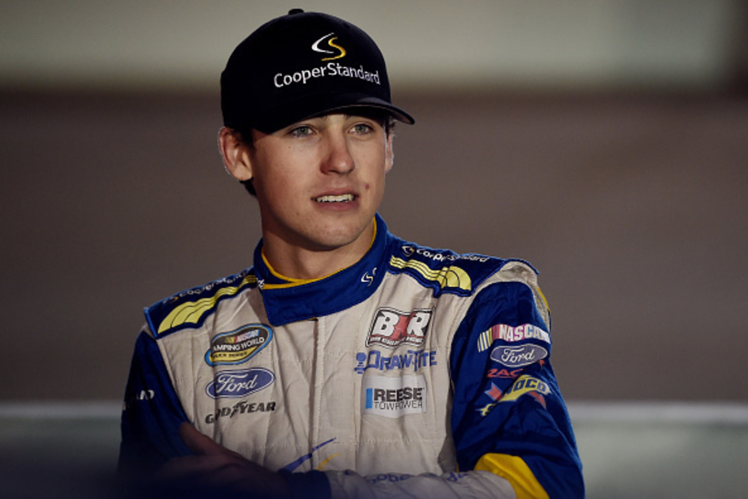HOMESTEAD, FL - NOVEMBER 14:  Ryan Blaney, driver of the #29 Cooper Standard Ford, stands on the grid during pre-race ceremonies for the NASCAR Camping World Truck Series Ford EcoBoost 200 at Homestead-Miami Speedway on November 14, 2014 in Homestead, Flo
