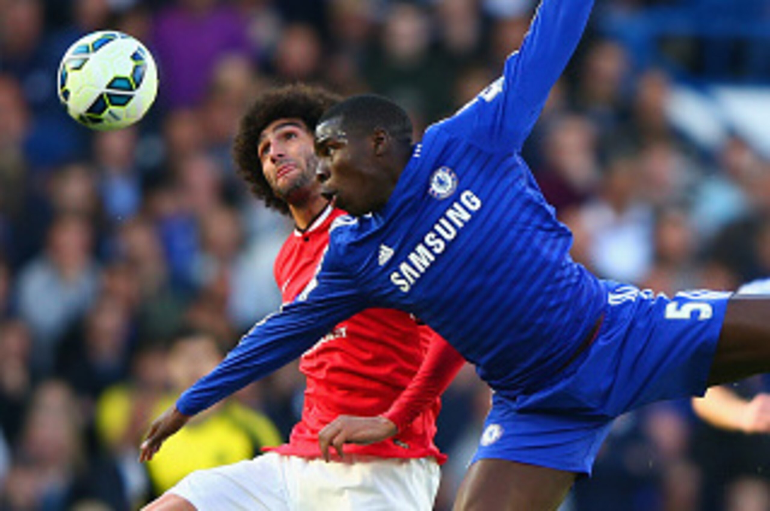 LONDON, ENGLAND - APRIL 18: Marouane Fellaini of Manchester United and Kurt Zouma of Chelsea battle for the ball during the Barclays Premier League match between Chelsea and Manchester United at Stamford Bridge on April 18, 2015 in London, England. (Pho LONDON, ENGLAND - APRIL 18: Marouane Fellaini of Manchester United and Kurt Zouma of Chelsea battle for the ball during the Barclays Premier League match between Chelsea and Manchester United at Stamford Bridge on April 18, 2015 in London, England. (Pho
