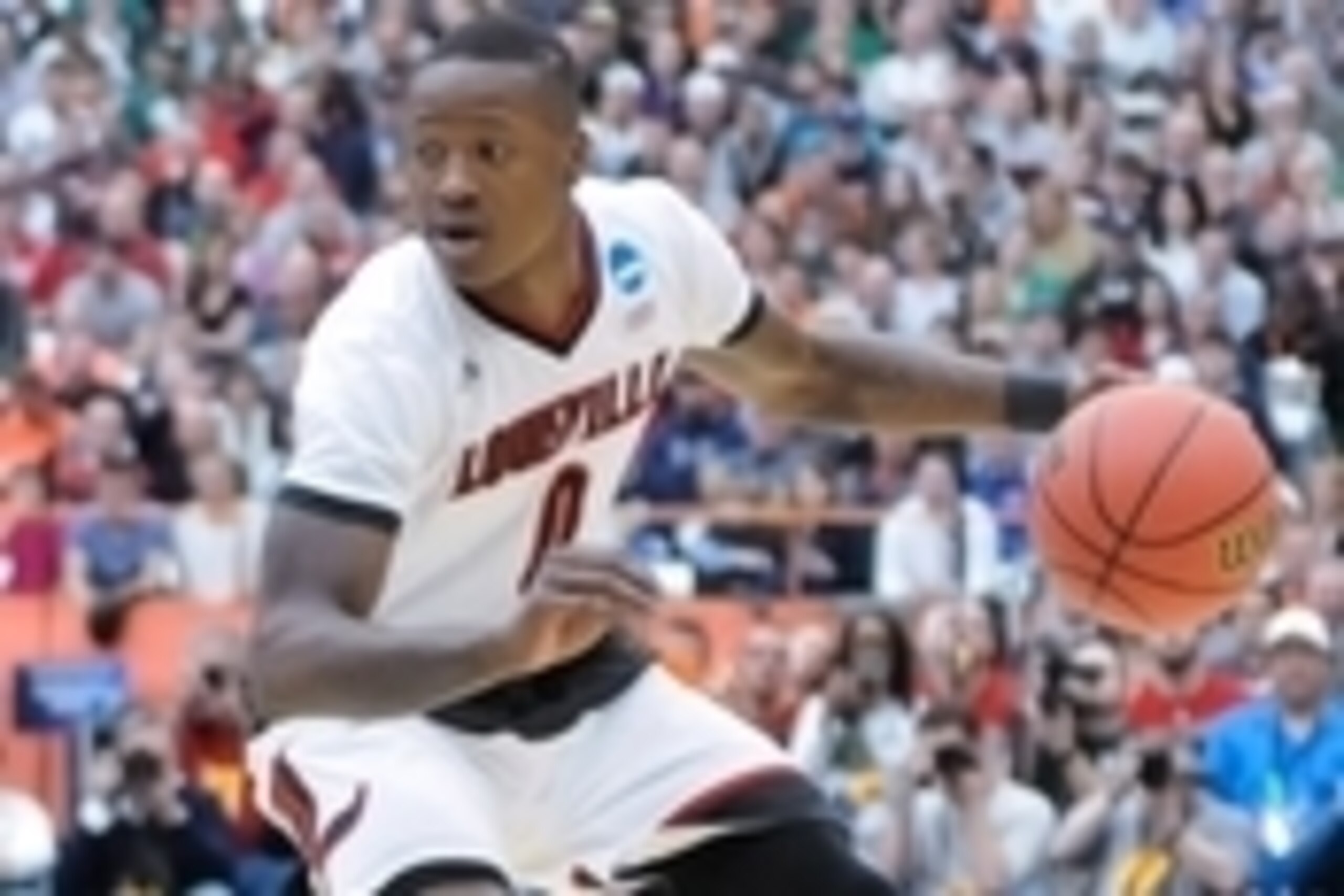 Mar 29, 2015; Syracuse, NY, USA; Louisville Cardinals guard Terry Rozier (0) handles the ball against the Michigan State Spartans during the first half in the finals of the east regional of the 2015 NCAA Tournament at the Carrier Dome. Mandatory Credit: M