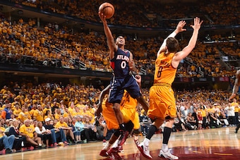 CLEVELAND,OH : Jeff Teague #0 of the Atlanta Hawks goes up for the layup against the Cleveland Cavaliers at the Quicken Loans Arena During Game Three of the Eastern Conference Finals during the 2015 NBA Playoffs on May 24, 2015 in Cleveland,OhioNOTE TO US