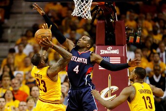 CLEVELAND, OH - MAY 24:  LeBron James #23 of the Cleveland Cavaliers goes up against Paul Millsap #4 of the Atlanta Hawks in the first quarter during Game Three of the Eastern Conference Finals of the 2015 NBA Playoffs at Quicken Loans Arena on May 24, 20