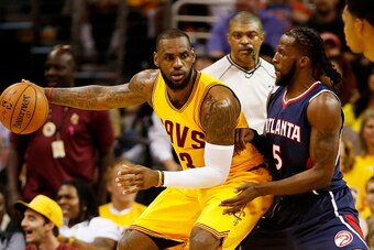 CLEVELAND, OH - MAY 24:  LeBron James #23 of the Cleveland Cavaliers drives against DeMarre Carroll #5 of the Atlanta Hawks in the first quarter during Game Three of the Eastern Conference Finals of the 2015 NBA Playoffs at Quicken Loans Arena on May 24, 