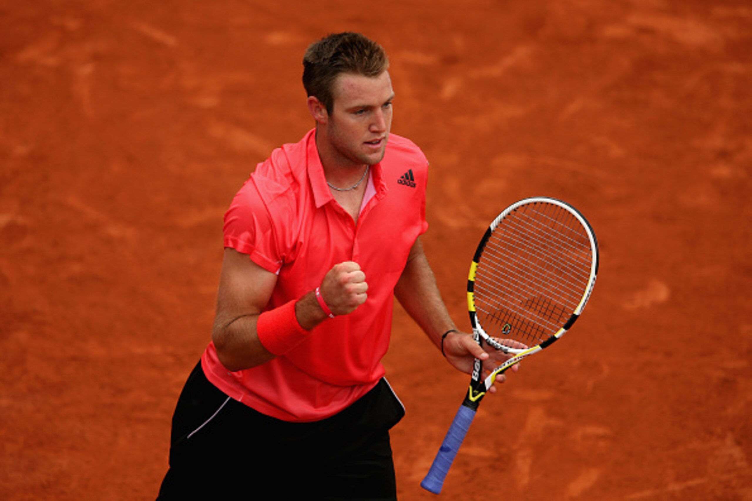 PARIS, FRANCE - MAY 26:  Jack Sock of the United States  celebrates a point in his Men's Singles match against Grigor Dimitrov of Bulgaria on day three of the 2015 French Open at Roland Garros on May 26, 2015 in Paris, France.  (Photo by Clive Mason/Getty