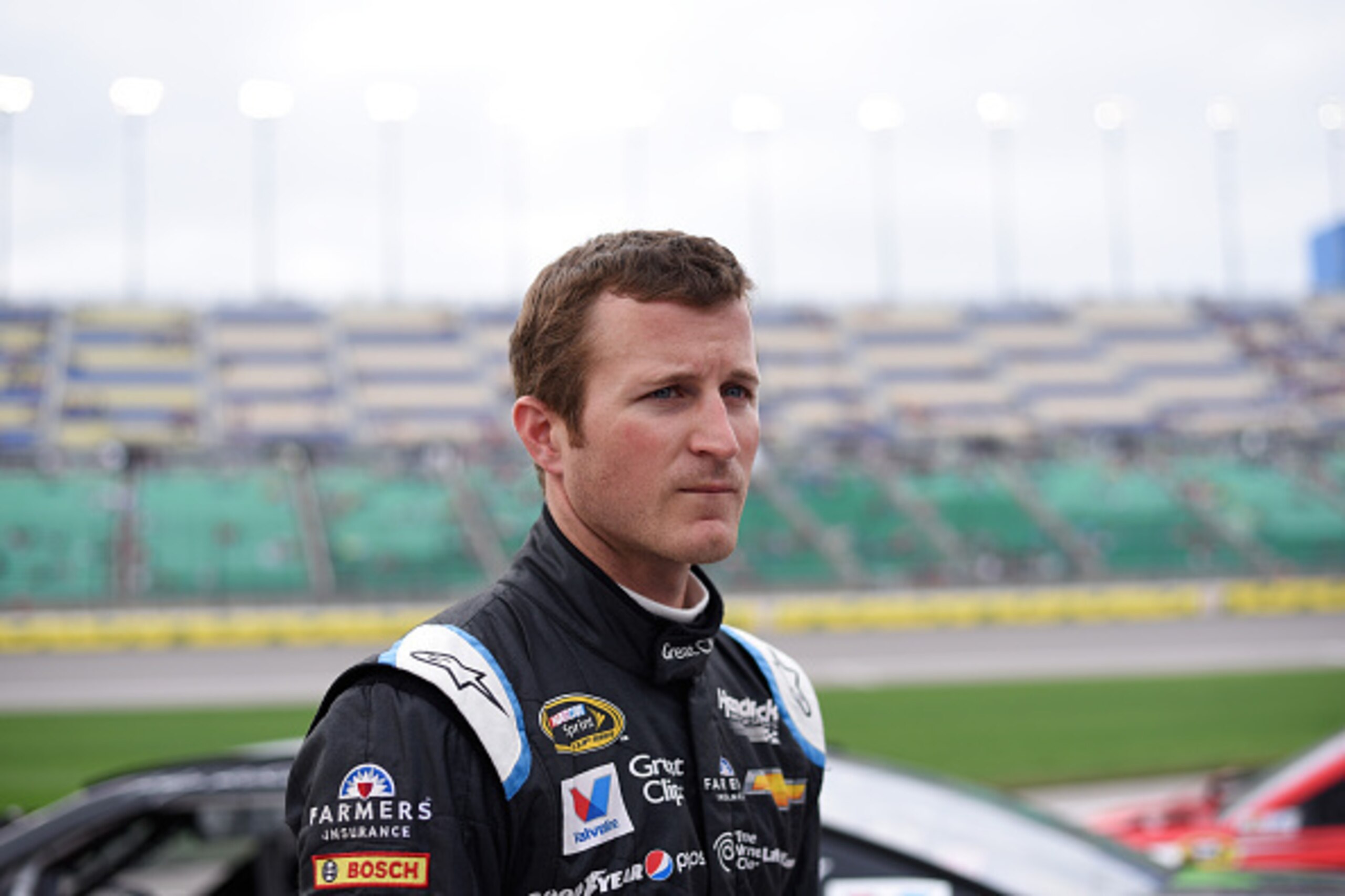 KANSAS CITY, KS - MAY 08: Kasey Kahne, driver of the #5 Great Clips Chevrolet, stands on the grid during qualifying for the NASCAR Sprint Cup Series SpongeBob SquarePants 400 at Kansas Speedway on May 8, 2015 in Kansas City, Kansas. (Photo by Ed Zurga/Ge KANSAS CITY, KS - MAY 08: Kasey Kahne, driver of the #5 Great Clips Chevrolet, stands on the grid during qualifying for the NASCAR Sprint Cup Series SpongeBob SquarePants 400 at Kansas Speedway on May 8, 2015 in Kansas City, Kansas. (Photo by Ed Zurga/Ge