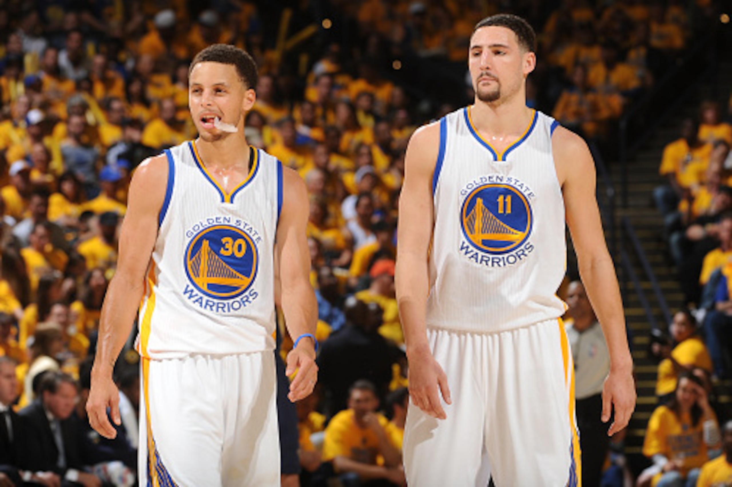 OAKLAND, CA - APRIL 18: Stephen Curry #30 of the Golden State Warriors and Klay Thompson #11 of the Golden State Warriors during Game One of the Western Conference Quarterfinals against the New Orleans Pelicans during the NBA Playoffs on April 18, 2015 at