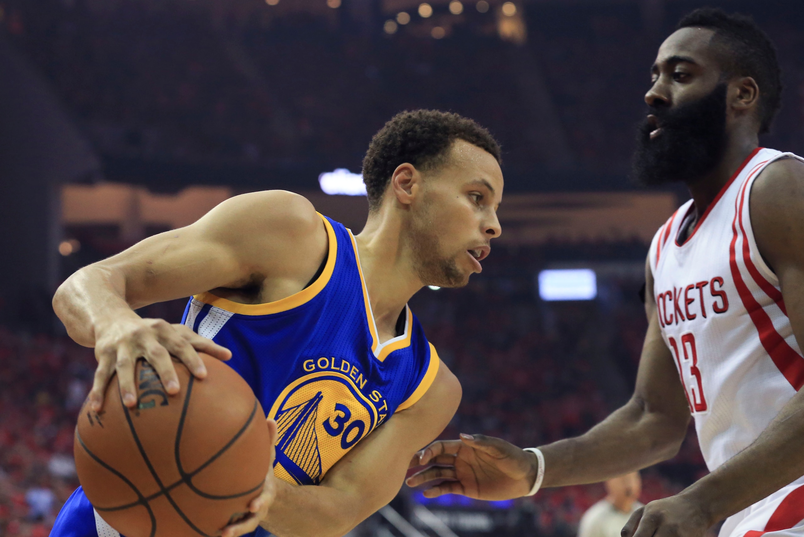 May 25, 2015; Houston, TX, USA; Golden State Warriors guard Stephen Curry (30) looks to drive as Houston Rockets guard James Harden (13) defends during the first quarter in game four of the Western Conference Finals of the NBA Playoffs. at Toyota Center.