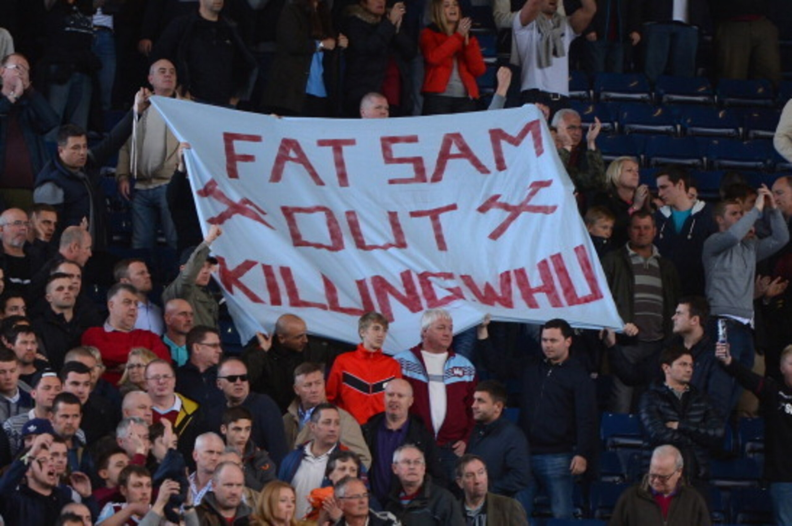 WEST BROMWICH, ENGLAND - APRIL 26: West Ham fans hold up a banner to West Ham manager Sam Allardyce during the Barclays Premier League match between West Bromwich Albion and West Ham United at The Hawthorns on April 26, 2014 in West Bromwich, England.  (P