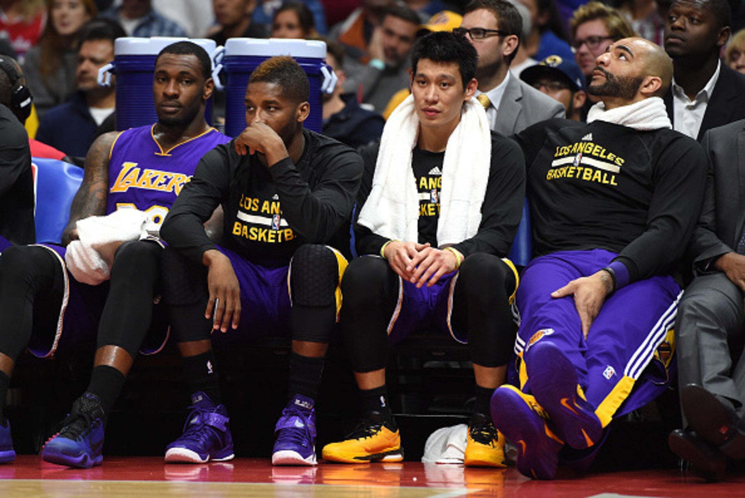 LOS ANGELES, CA - APRIL 07:  Tarik Black #28, Dwight Buycks #20, Jeremy Lin #17 and Carlos Boozer #5 of the Los Angeles Lakers sit on the bench during a 105-100 Los Angeles Clippers win at Staples Center on April 7, 2015 in Los Angeles, California.  NOTE 