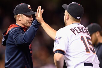 MINNEAPOLIS, MN - MAY 01: Manager Paul Molitor #4 and Glen Perkins #15 of the Minnesota Twins celebrate a win of the game against the Chicago White Sox on May 1, 2015 at Target Field in Minneapolis, Minnesota. The Twins defeated the White Sox 1-0. (Photo 