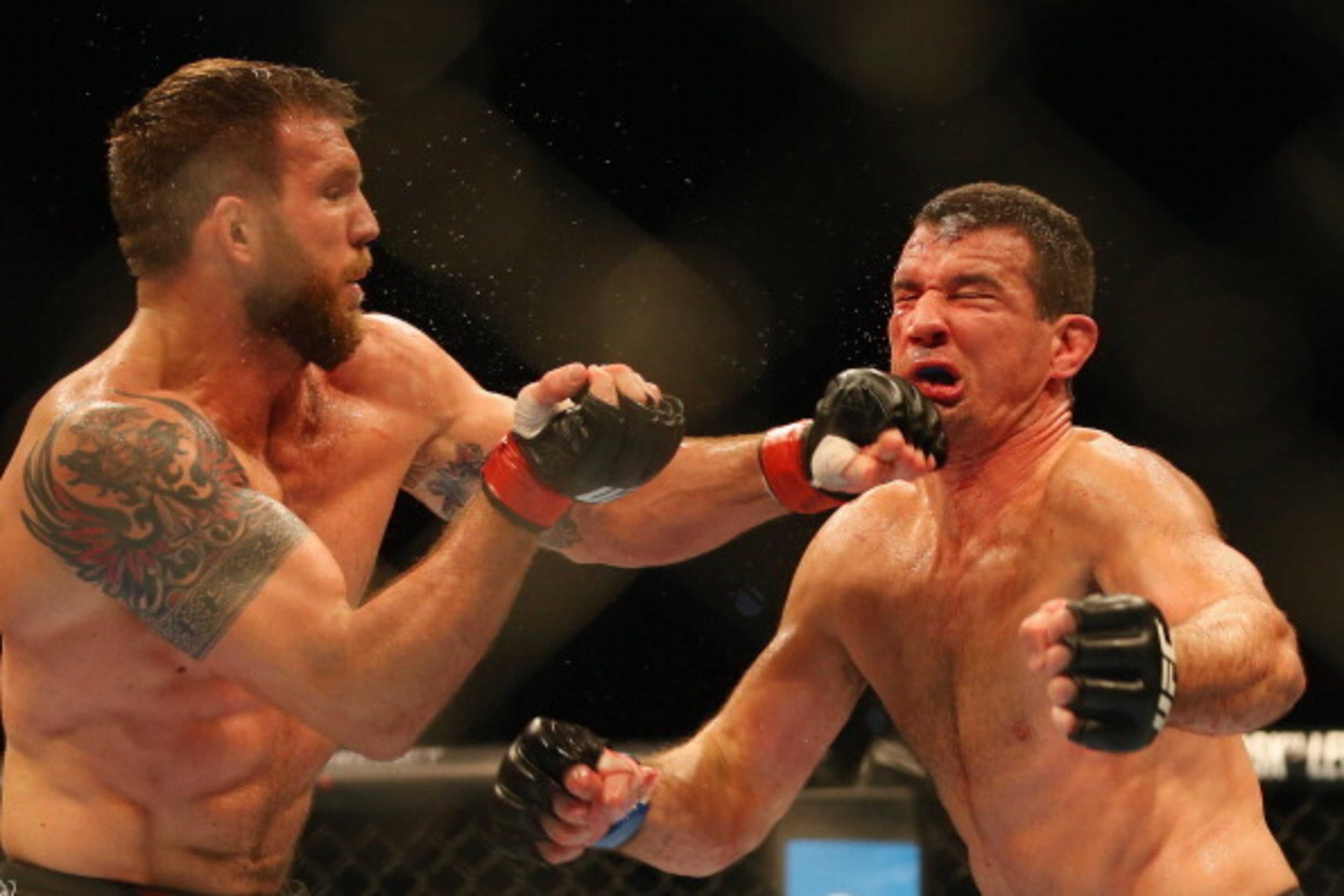 BRISBANE, AUSTRALIA - DECEMBER 07:  Ryan Bader of the USA punches Anthony Perosh of Australia in their light heavyweight fight during the UFC Fight Night event at Brisbane Entertainment Centre on December 7, 2013 in Brisbane, Australia.  (Photo by Chris H
