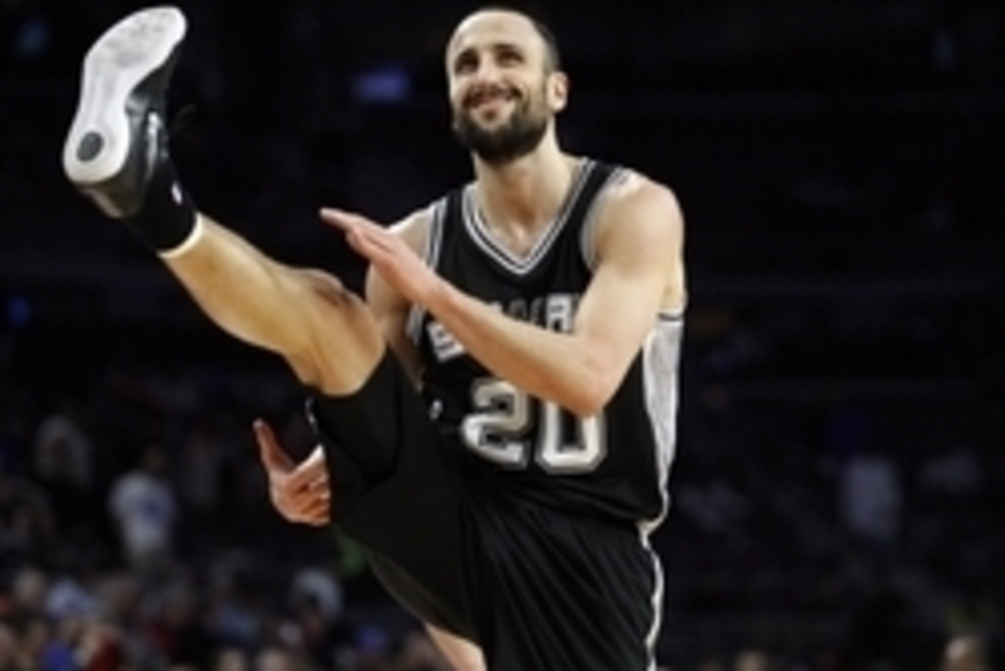 Feb 11, 2015; Auburn Hills, MI, USA; San Antonio Spurs guard Manu Ginobili (20) kicks his leg up to stretch during the fourth quarter against the Detroit Pistons at The Palace of Auburn Hills. Spurs beat the Pistons 104-87. Mandatory Credit: Raj Mehta-USA