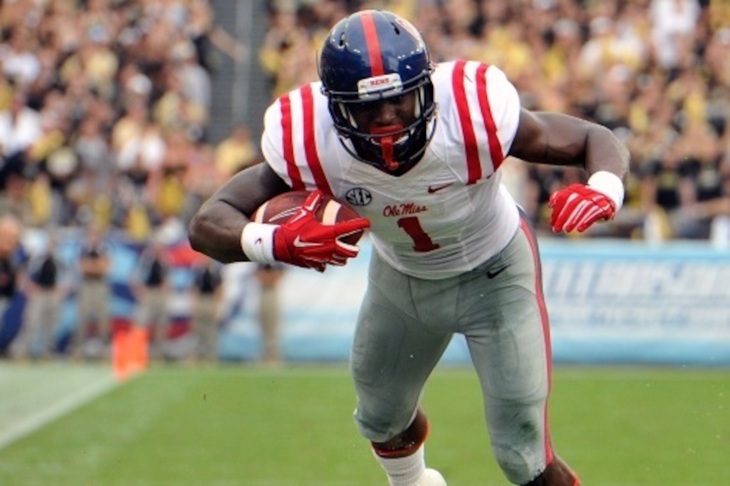 NASHVILLE, TN - SEPTEMBER 06:  Tre Bell #04 of the Vanderbilt Commodores tackles Laquon Treadwell #1 of the Ole Miss Rebels at L.P.Field on September 6, 2014 in Nashville, Tennessee.  (Photo by Frederick Breedon/Getty Images)