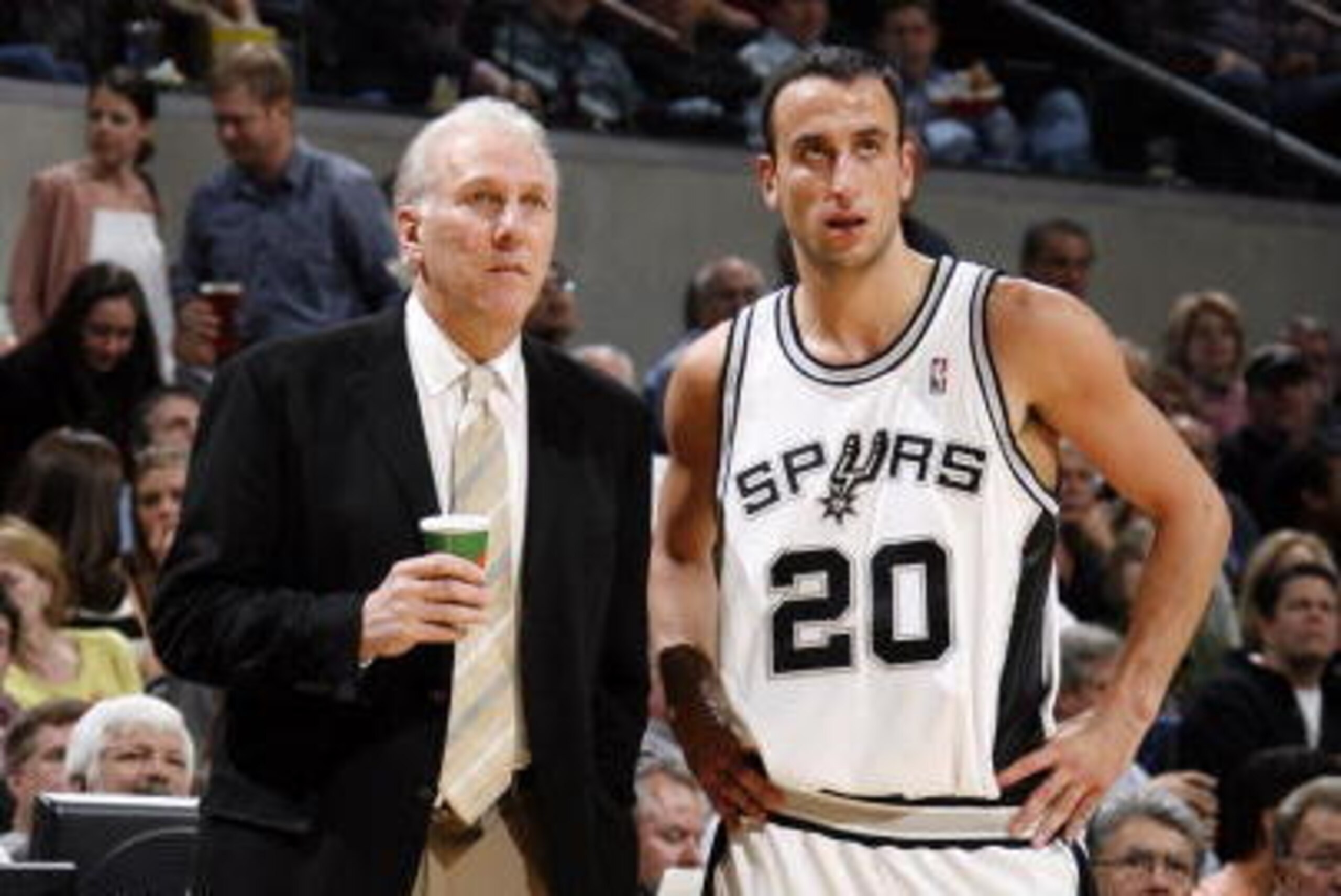 SAN ANTONIO, TX - DECEMBER 5: Greg Popovich, head coach of the San Antonio Spurs talks with Manu Ginobili #20 of the San Antonio Spurs during a game against the Dallas Mavericks on December 5, 2007 at the AT&T Center in San Antonio, Texas.  NOTE TO USER: 