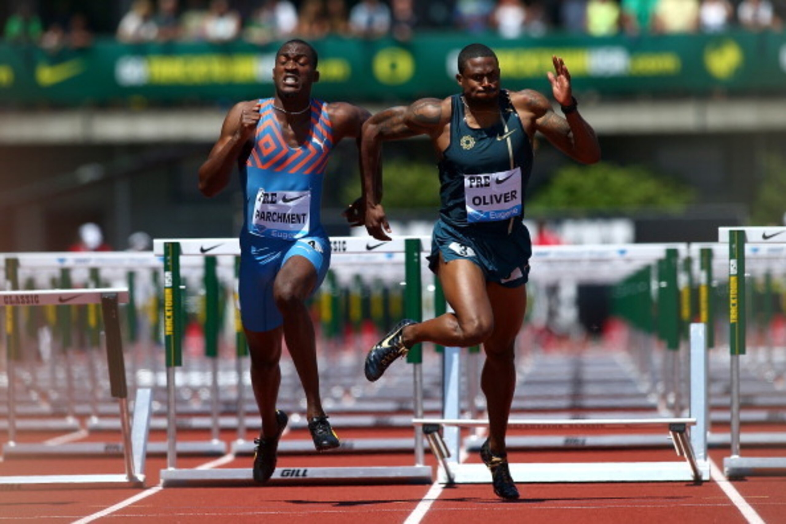 EUGENE, OR - MAY 31:  David Oliver of the United States and Hansle Parchment  of Jamaica run in the 110m Hurdles during day 2 of the IAAF Diamond League Nike Prefontaine Classic on May 31, 2014 at the Hayward Field in Eugene, Oregon.  (Photo by Jonathan F