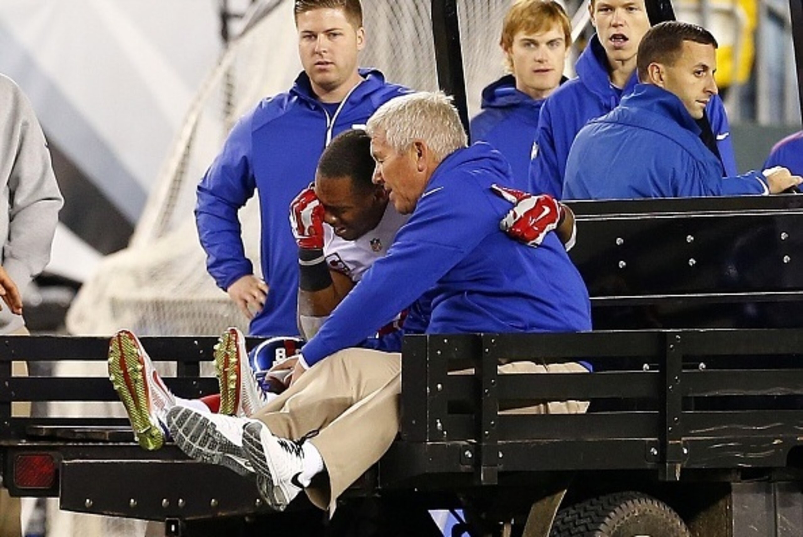 PHILADELPHIA, PA - OCTOBER 12: Victor Cruz #80 of the New York Giants is carted off the field after attempting a catch in the end zone during the third quarter of a football game at Lincoln Financial Field on October 12, 2014 in Philadelphia, Pennsylvania