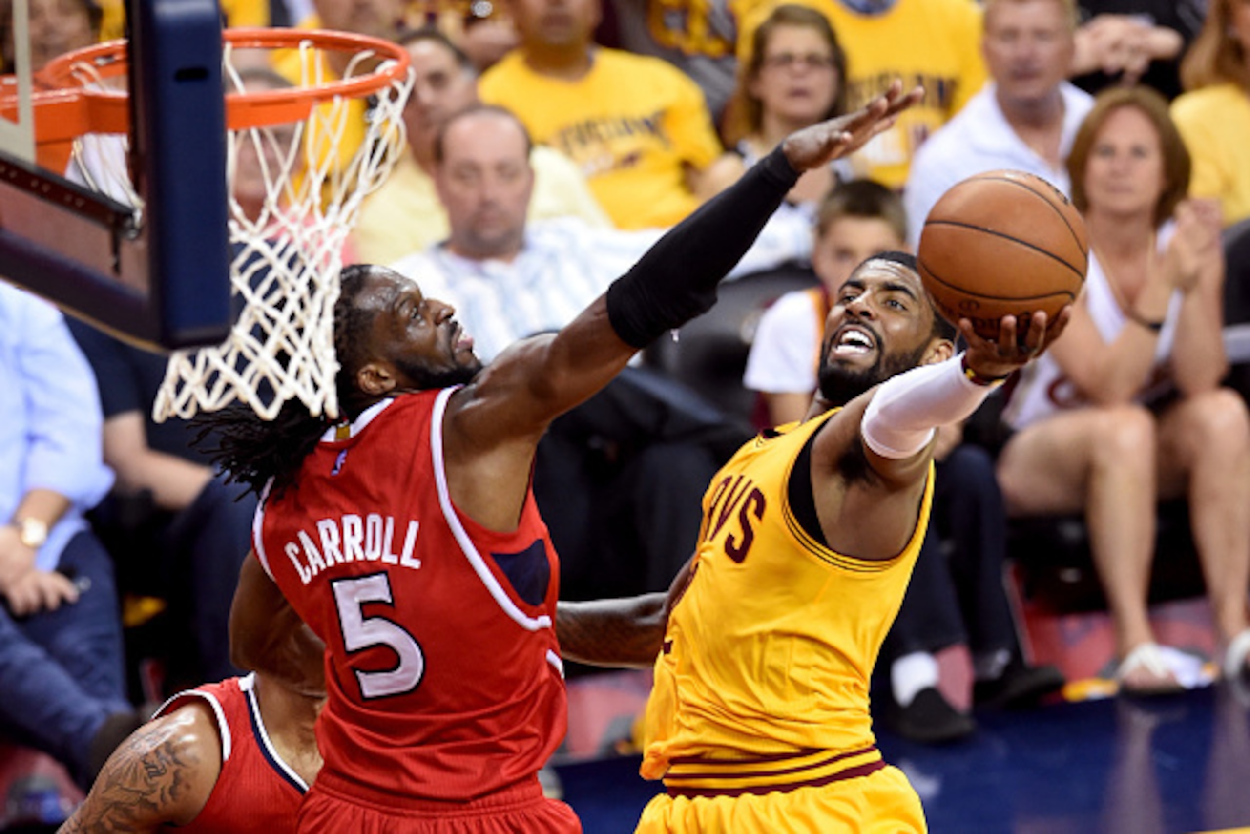 CLEVELAND, OH - MAY 26: Kyrie Irving #2 of the Cleveland Cavaliers drives to the basket against DeMarre Carroll #5 of the Atlanta Hawks in the first half during Game Four of the Eastern Conference Finals of the 2015 NBA Playoffs at Quicken Loans Arena on CLEVELAND, OH - MAY 26: Kyrie Irving #2 of the Cleveland Cavaliers drives to the basket against DeMarre Carroll #5 of the Atlanta Hawks in the first half during Game Four of the Eastern Conference Finals of the 2015 NBA Playoffs at Quicken Loans Arena on