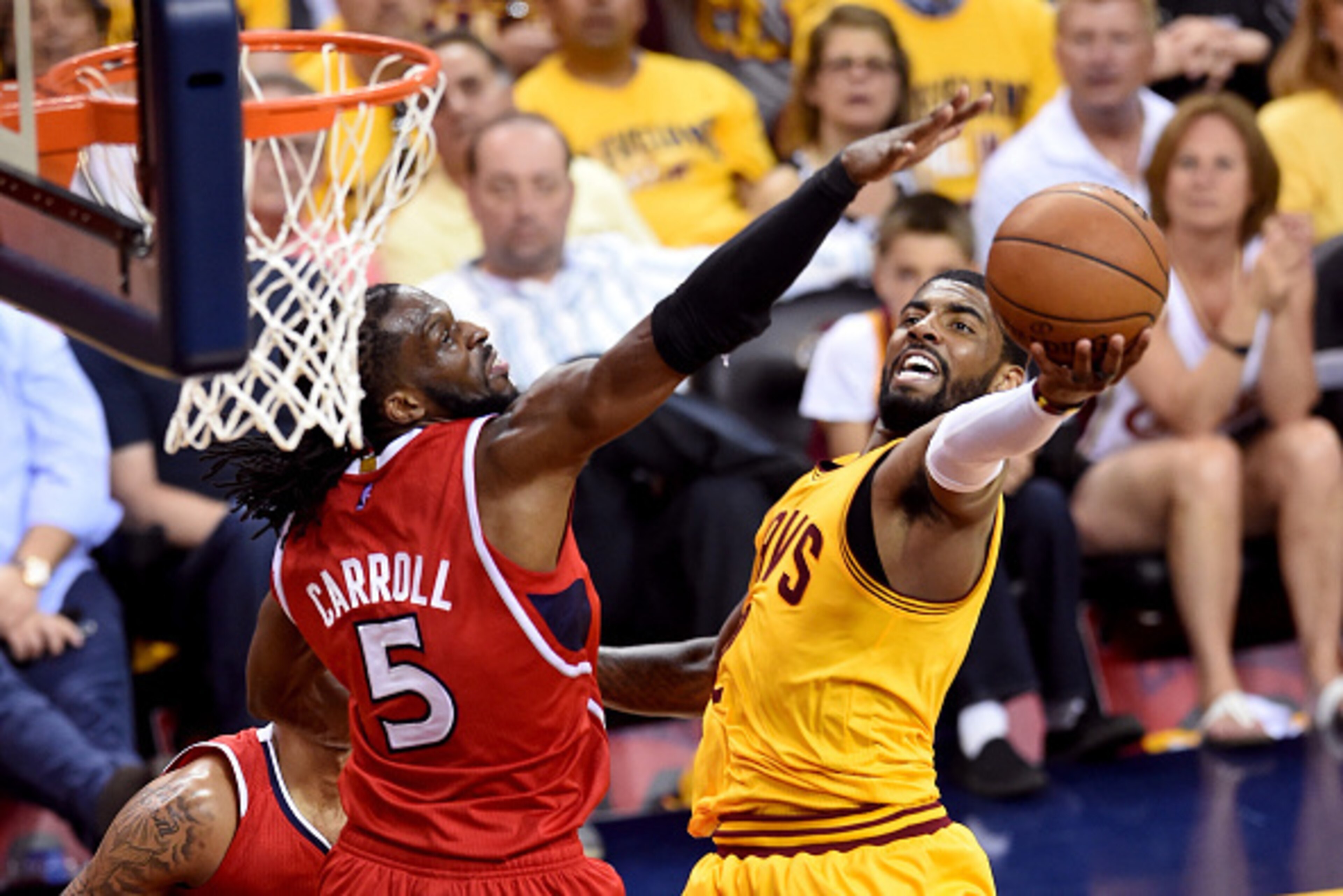 CLEVELAND, OH - MAY 26: Kyrie Irving #2 of the Cleveland Cavaliers drives to the basket against DeMarre Carroll #5 of the Atlanta Hawks in the first half during Game Four of the Eastern Conference Finals of the 2015 NBA Playoffs at Quicken Loans Arena on 