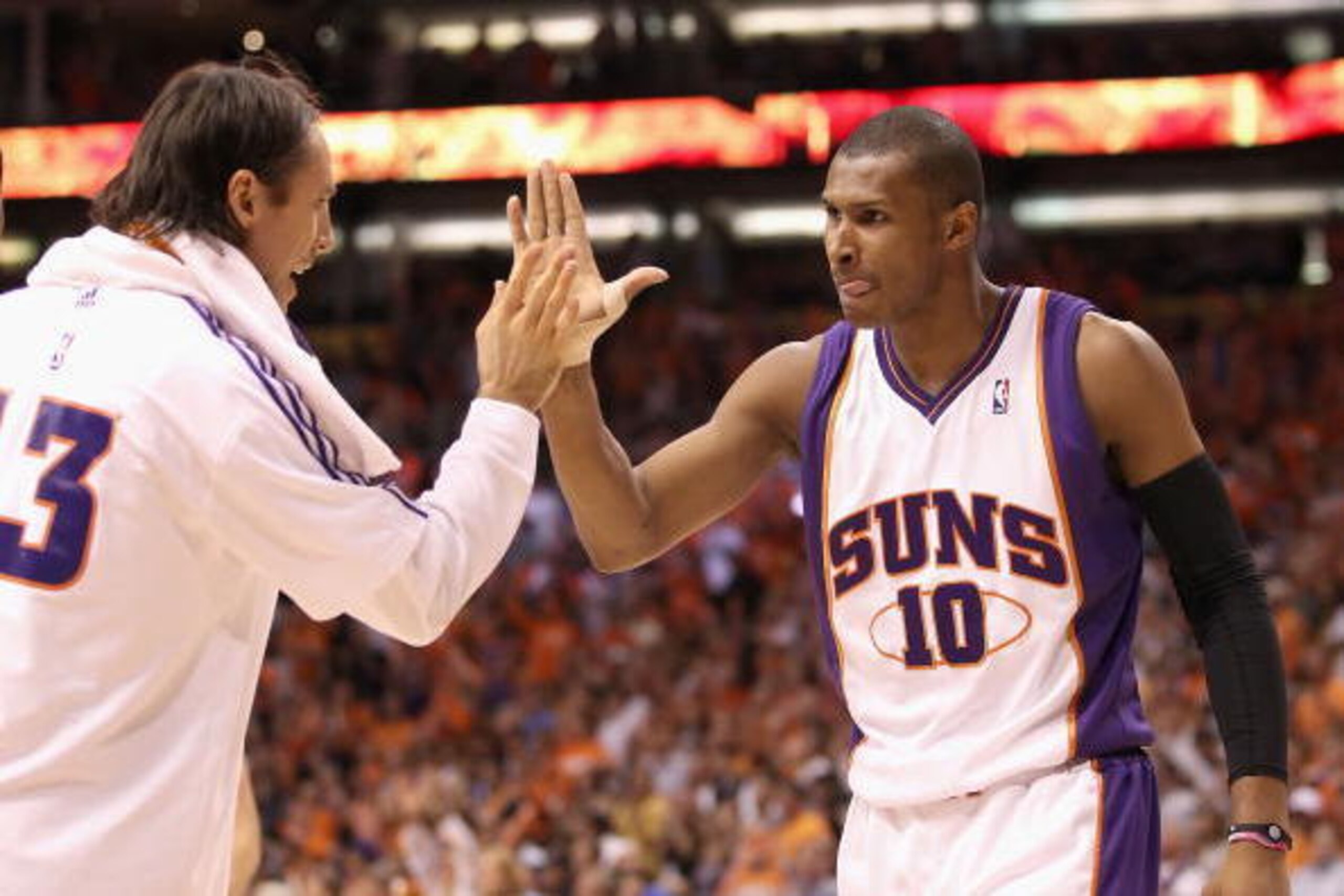 PHOENIX - MAY 25:  Leandro Barbosa #!0 of the Phoenix Suns celebrates with teammate Steve Nash #13 during Game Four of the Western Conference finals of the 2010 NBA Playoffs against the Los Angeles Lakers at US Airways Center on May 25, 2010 in Phoenix, A