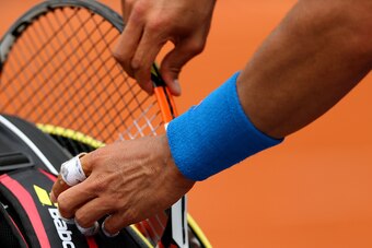 PARIS, FRANCE - MAY 26:  A detailed view as Rafael Nadal of Spain changes racquet in his Men's Singles match against Quentin Halys of France on day three of the 2015 French Open at Roland Garros on May 26, 2015 in Paris, France.  (Photo by Clive Brunskill