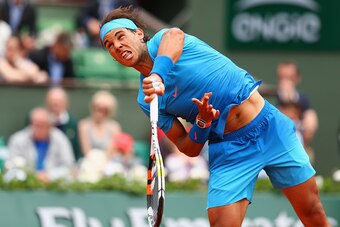 PARIS, FRANCE - MAY 26:  Rafael Nadal of Spain serves in his Men's Singles match against Quentin Halys of France on day three of the 2015 French Open at Roland Garros on May 26, 2015 in Paris, France.  (Photo by Clive Brunskill/Getty Images)