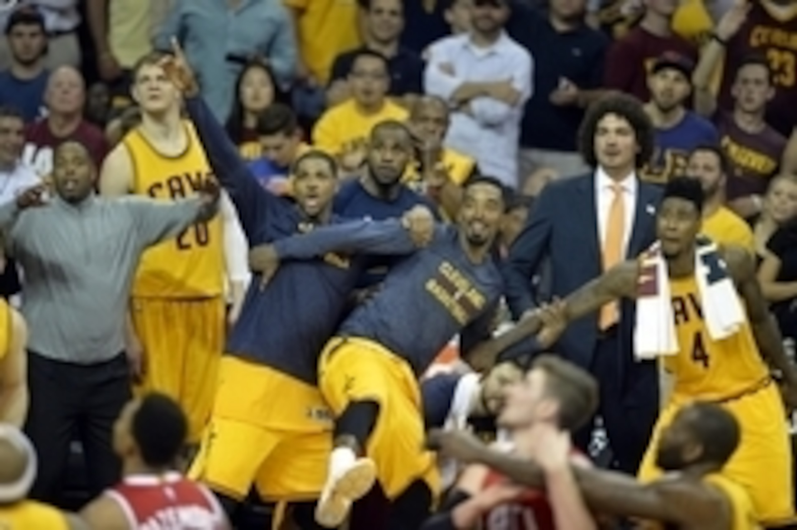 May 26, 2015; Cleveland, OH, USA; Cleveland Cavaliers center Tristan Thompson (13), guard J.R. Smith (5), forward LeBron James (23) and guard Iman Shumpert (4) react from the bench during the fourth quarter against the Atlanta Hawks in game four of the Ea
