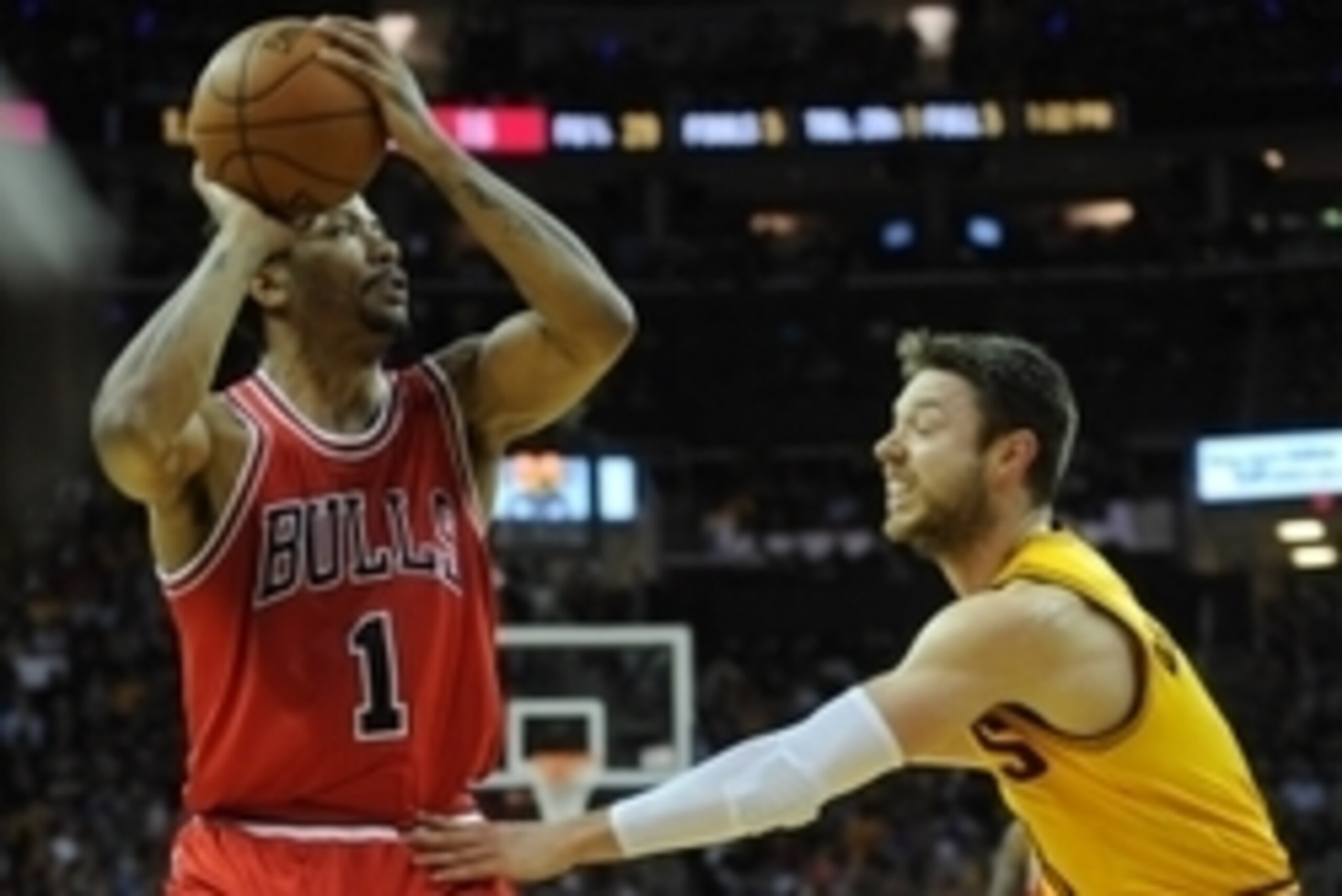 May 6, 2015; Cleveland, OH, USA; Chicago Bulls guard Derrick Rose (1) and Cleveland Cavaliers guard Matthew Dellavedova (8) in game two of the second round of the NBA Playoffs at Quicken Loans Arena. Mandatory Credit: Ken Blaze-USA TODAY Sports