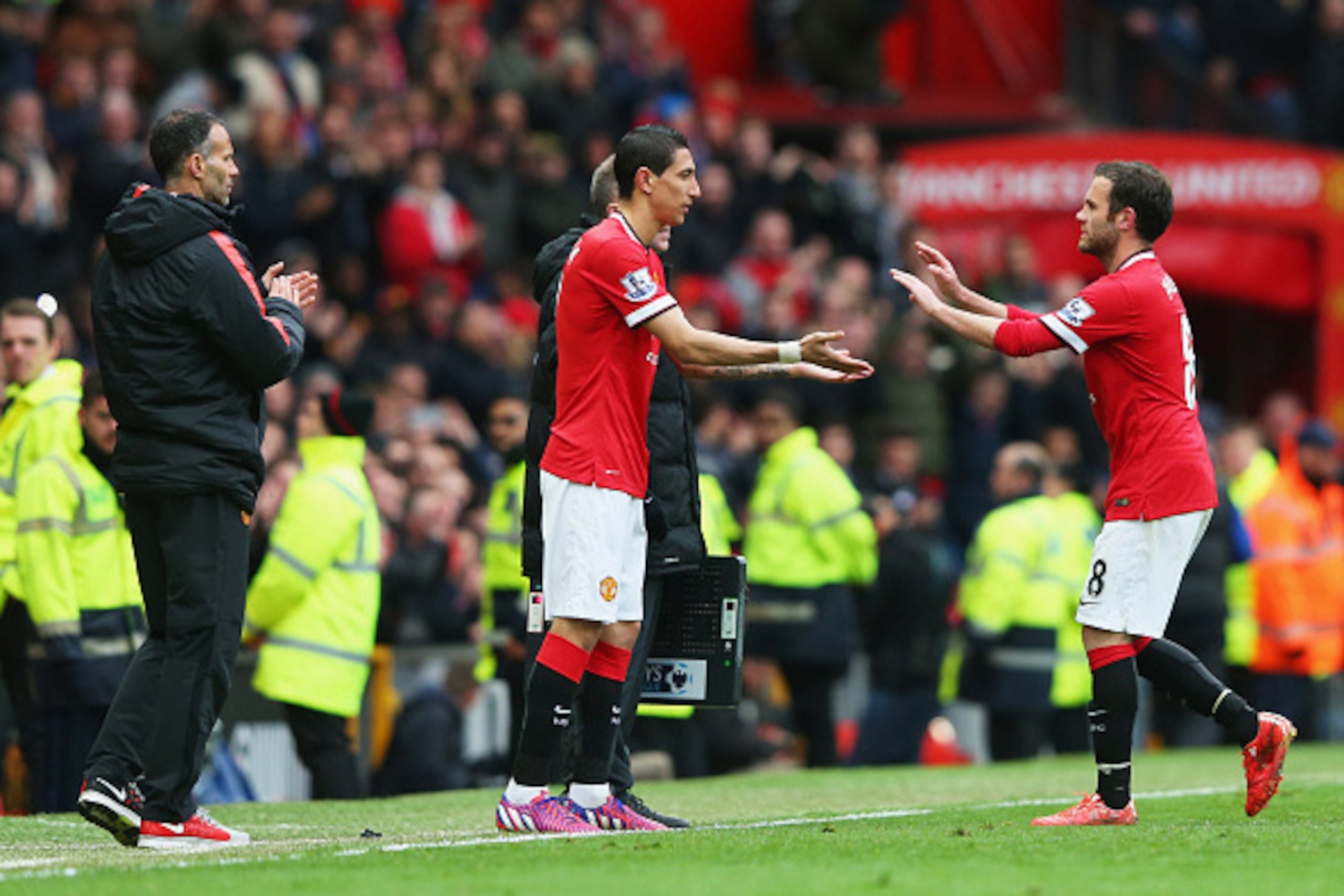 MANCHESTER, ENGLAND - APRIL 12:  Angel di Maria of Manchester United replaces Juan Mata as a substitute during the Barclays Premier League match between Manchester United and Manchester City at Old Trafford on April 12, 2015 in Manchester, England.  (Phot
