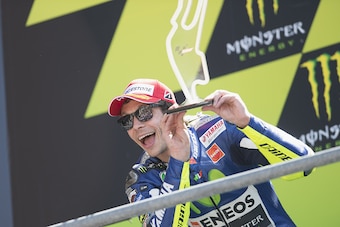 LE MANS, FRANCE - MAY 17:  Valentino Rossi of Italy and Movistar Yamaha MotoGP celebrates on the podium the second place at the end of the MotoGP race during the MotoGp of France - Race at  on May 17, 2015 in Le Mans, France.  (Photo by Mirco Lazzari gp/G