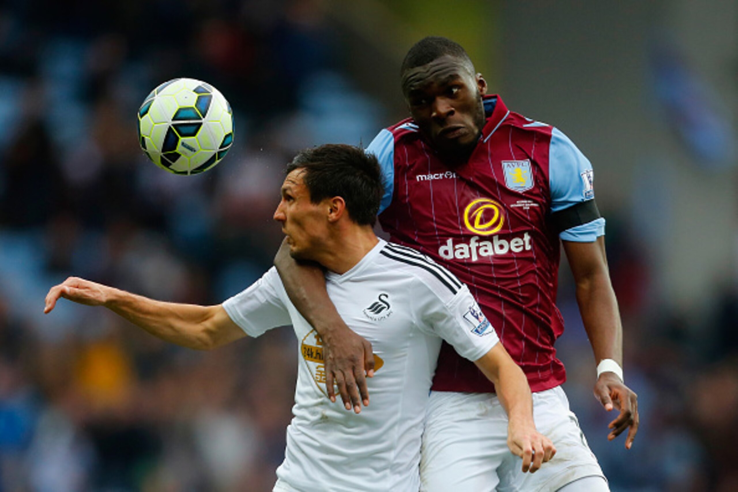 BIRMINGHAM, ENGLAND - MARCH 21:  Christian Benteke of Aston Villa and Jack Cork of Swansea City compete for the ball during the Barclays Premier League match between Aston Villa and Swansea City at Villa Park on March 21, 2015 in Birmingham, England.  (Ph