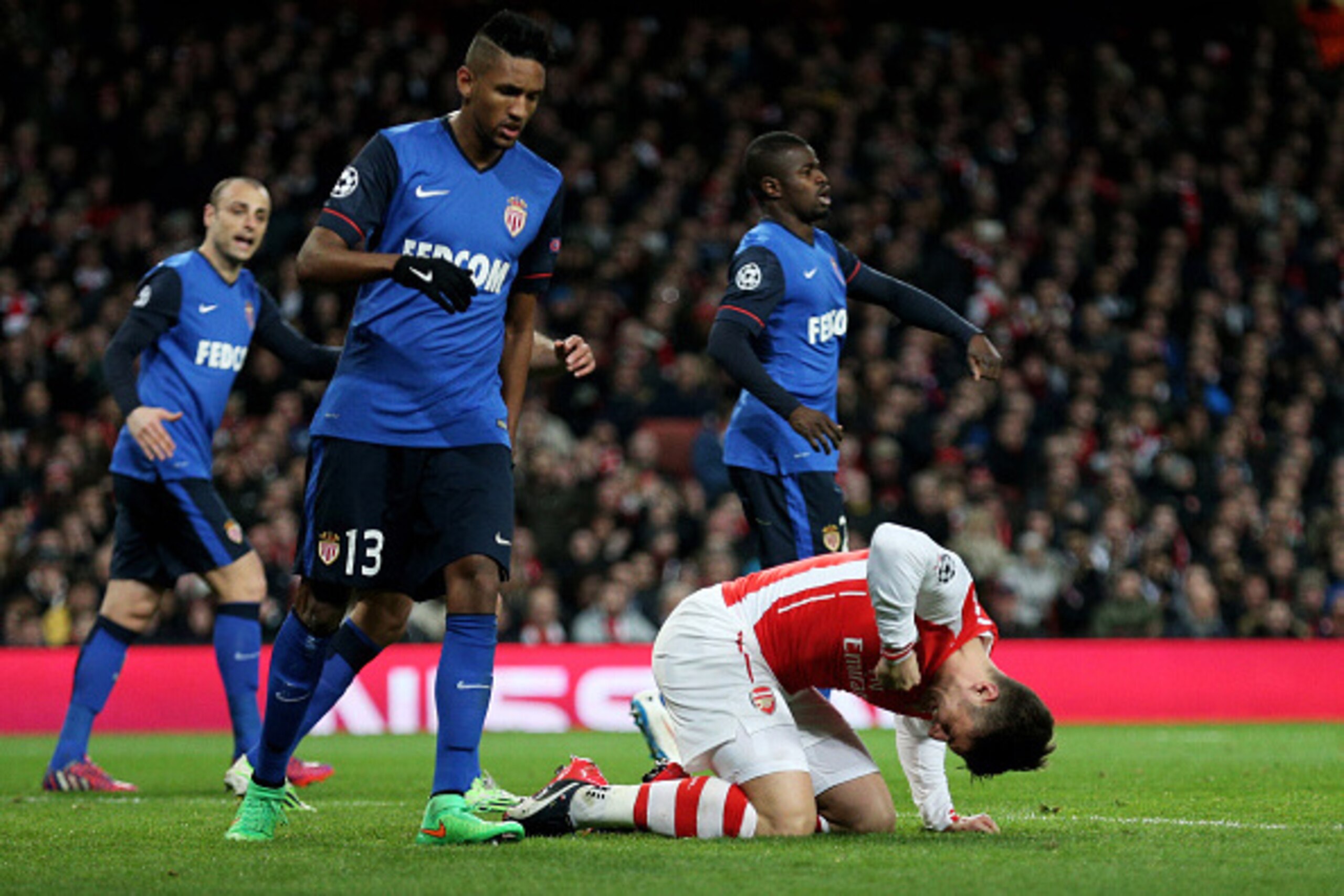 LONDON, ENGLAND - FEBRUARY 25:  Robert Giroud of Arsenal punches the grounds after missing a chance on goal during the UEFA Champions League round of 16, first leg match between Arsenal and Monaco at The Emirates Stadium on February 25, 2015 in London, Un
