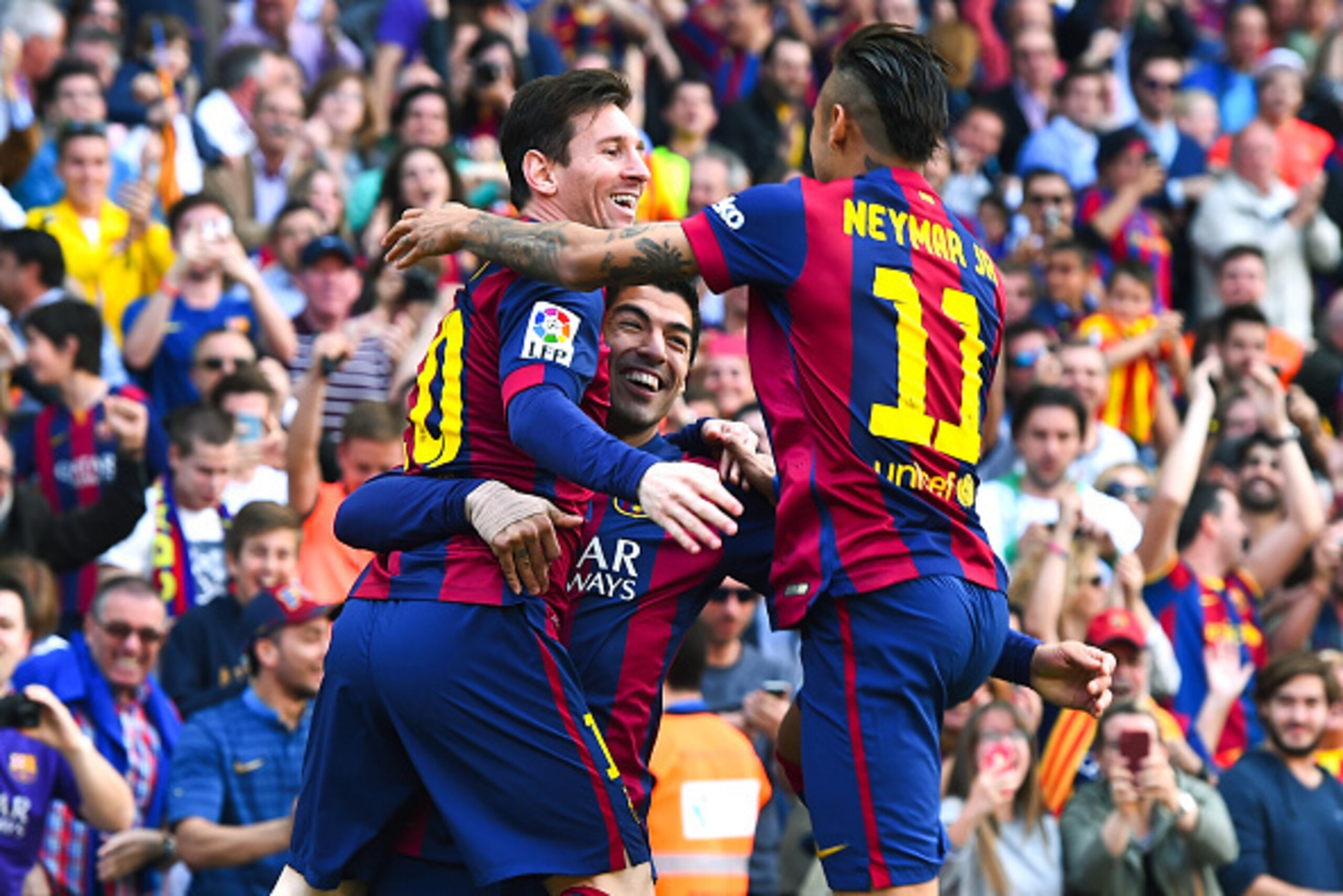 BARCELONA, SPAIN - APRIL 18:  Luis Suarez (C) of FC Barcelona celebrates with his team mates Lionel Messi (L) and Neymar of FC Barcelona after scoring the opening goal during the La Liga match between FC Barcelona and Valencia CF at Camp Nou on April 18, 
