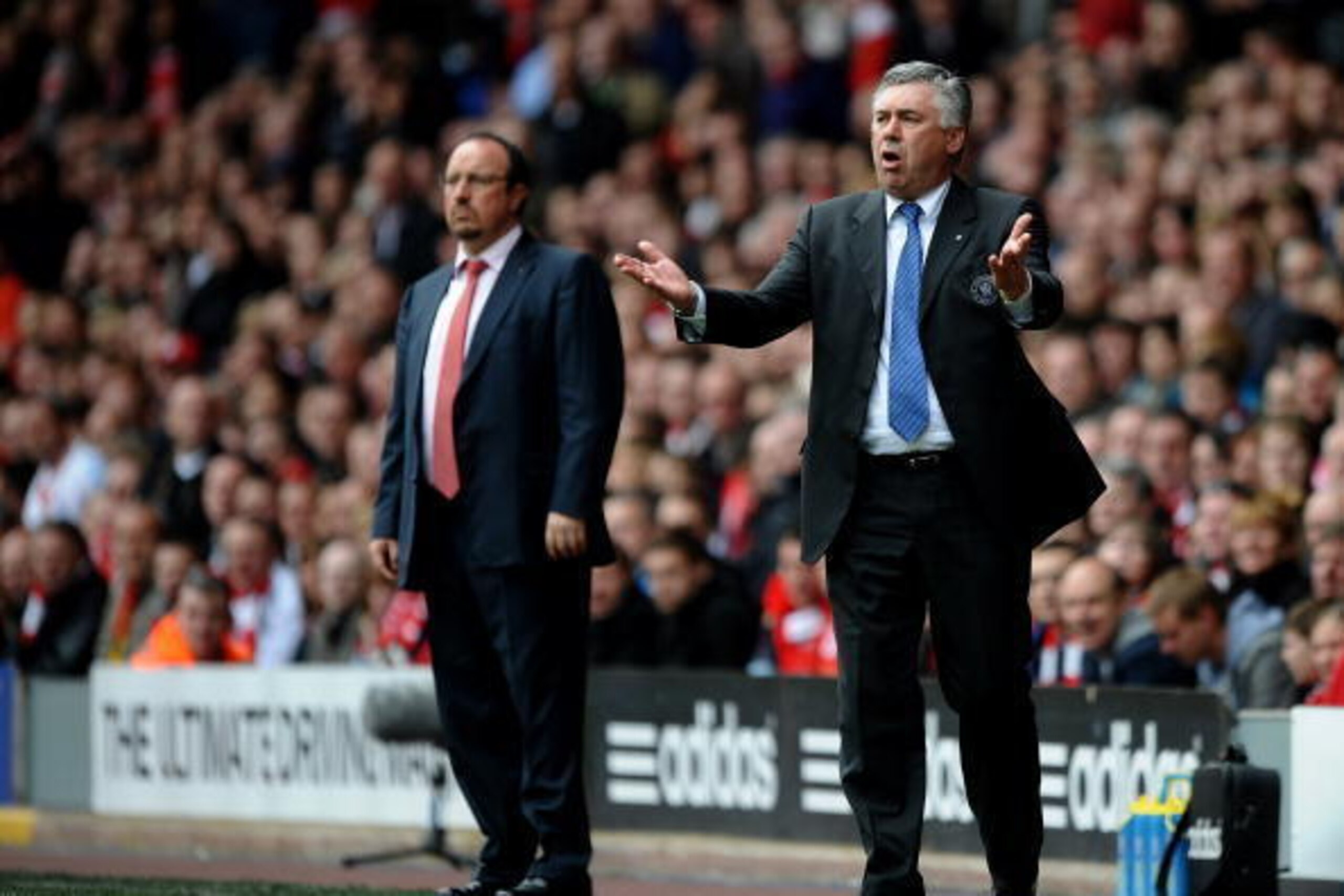 LIVERPOOL, ENGLAND - MAY 02:  Carlo Ancelotti the Chelsea manager reacts to events on the pitch as Rafael Benitez the Liverpool manager looks on during the Barclays Premier League match between Liverpool and Chelsea at Anfield on May 2, 2010 in Liverpool,