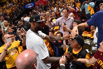 CLEVELAND,OH - MAY 26:  LeBron James #23 of the Cleveland Cavaliers greets young fans after game four against the Atlanta Hawks at the Quicken Loans Arena During Game Four of the Eastern Conference Finals during the 2015 NBA Playoffs on May 26, 2015 in Cl