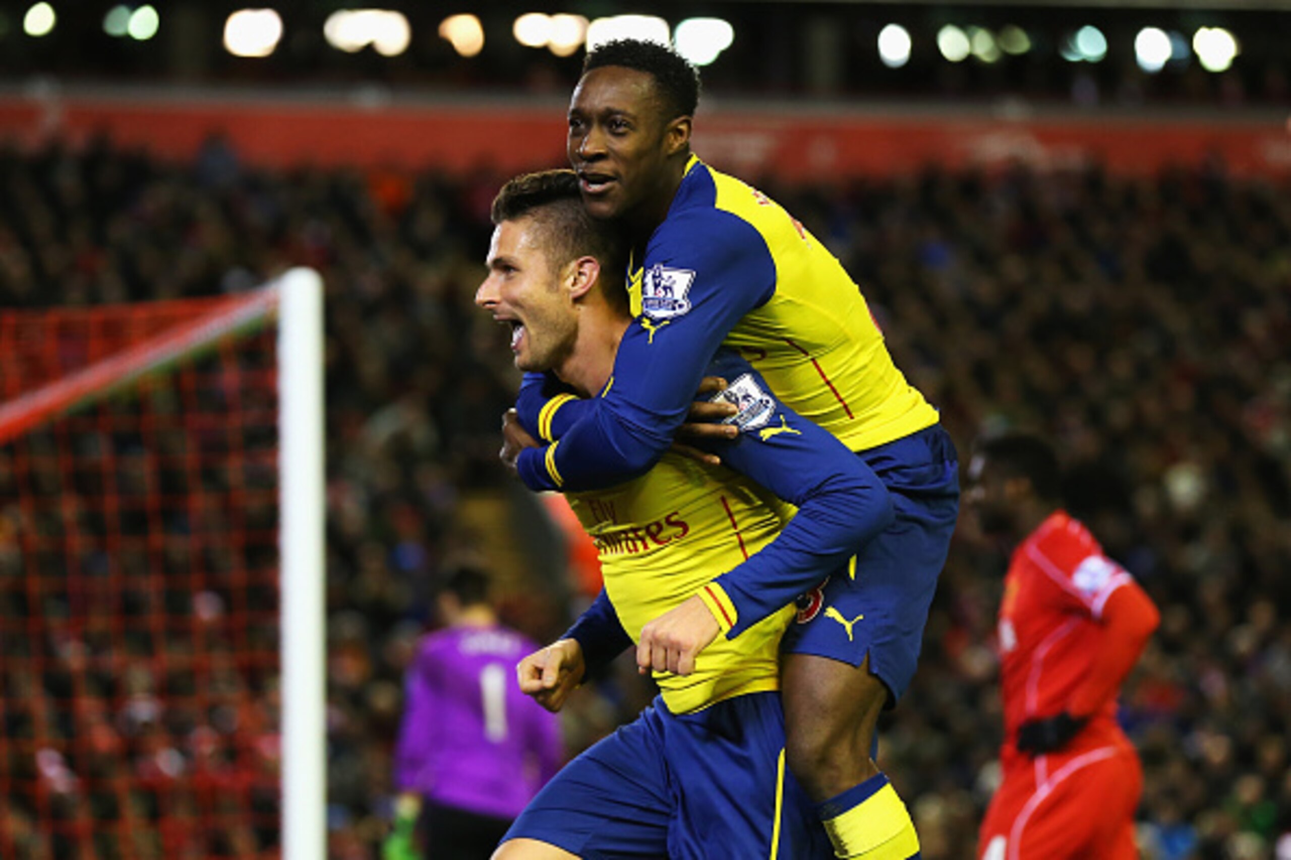 LIVERPOOL, ENGLAND - DECEMBER 21:  Olivier Giroud of Arsenal celebrates scoring his goal with Danny Welbeck of Arsenal during the Barclays Premier League match between Liverpool and Arsenal at Anfield on December 21, 2014 in Liverpool, England.  (Photo by