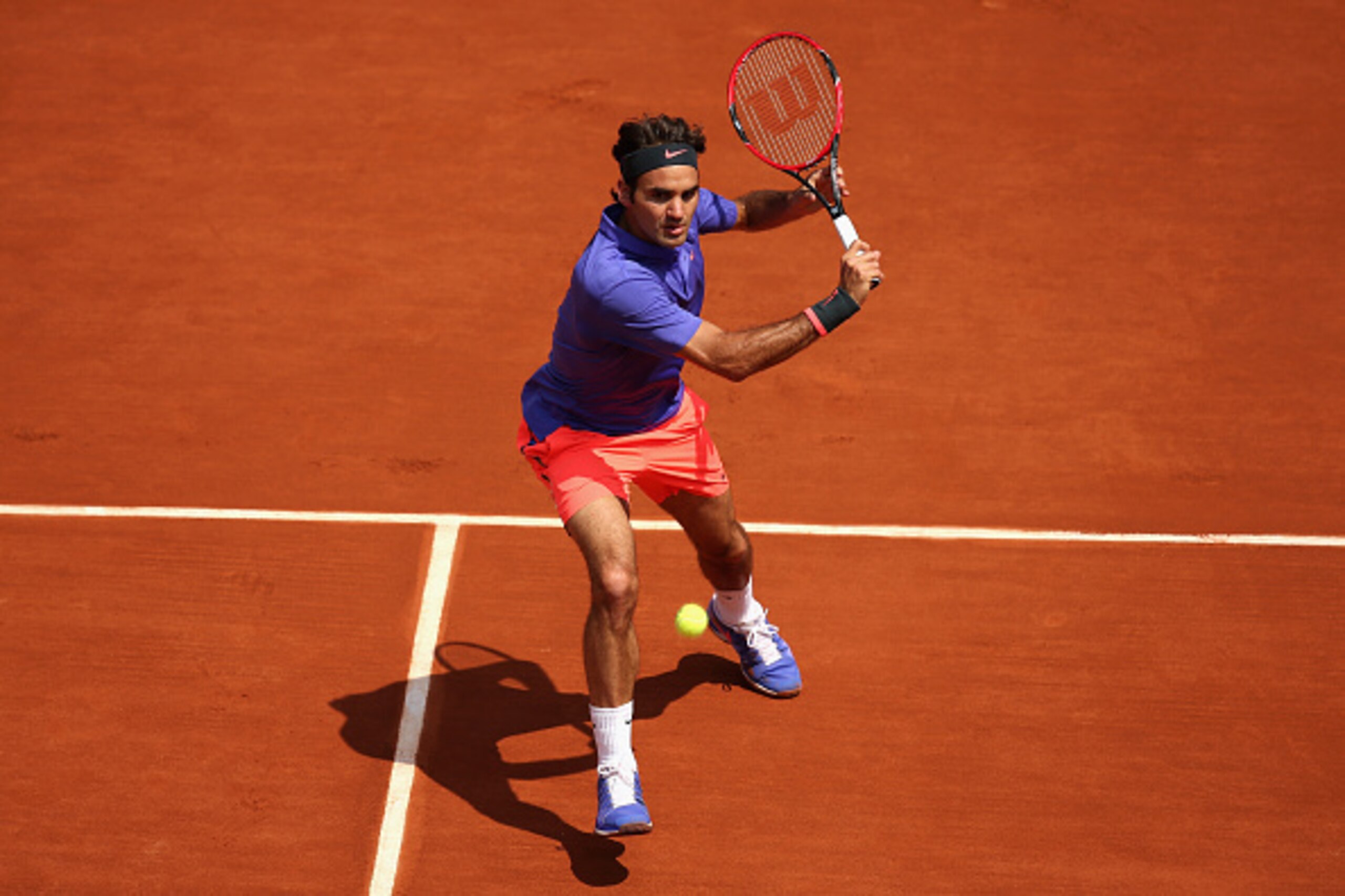 PARIS, FRANCE - MAY 27:  Roger Federer of Switzerland plays a backhand during his Men's Singles match against Marcel Granollers of Spain during day four of the 2015 French Open at Roland Garros on May 27, 2015 in Paris, France.  (Photo by Clive Mason/Gett