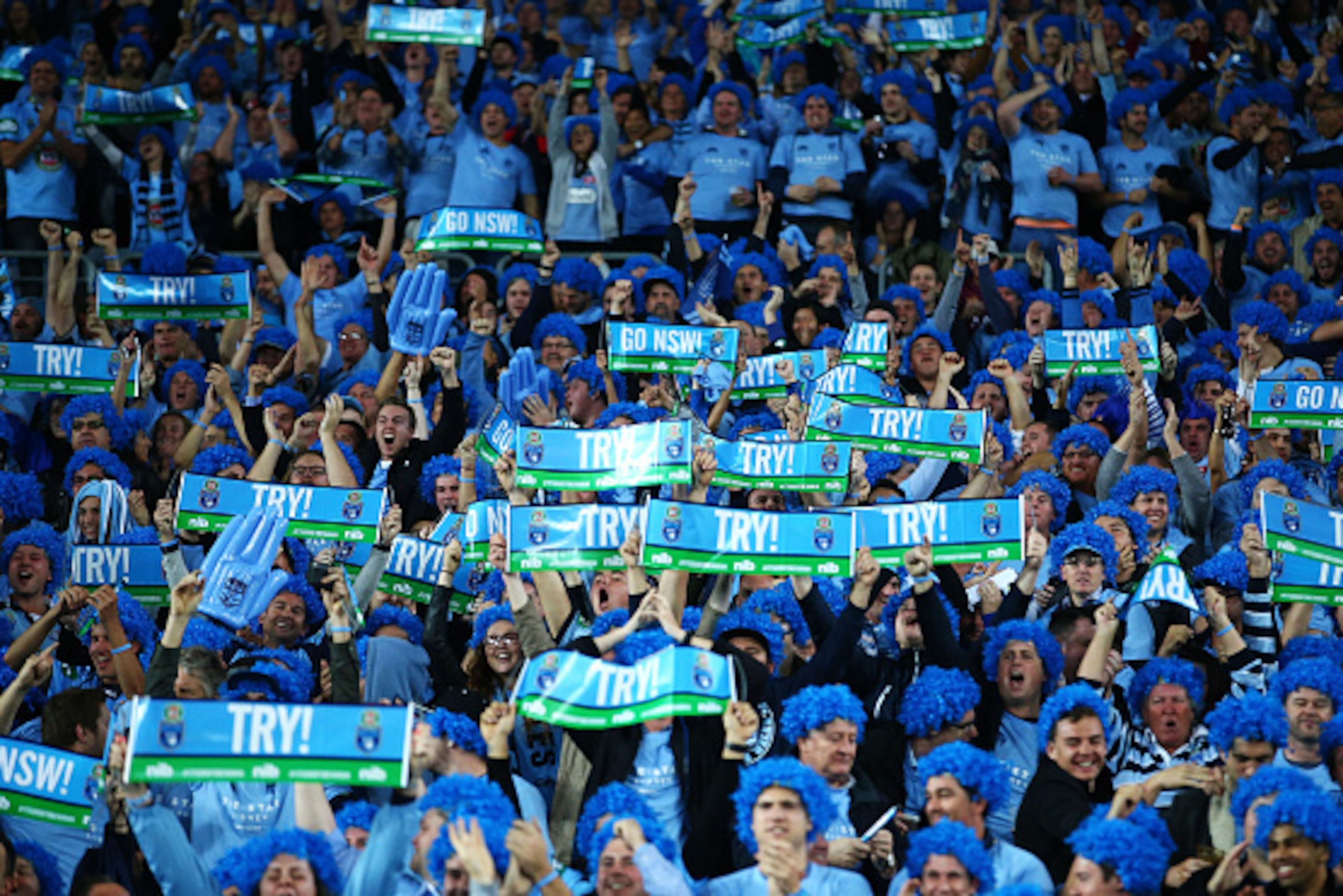 SYDNEY, AUSTRALIA - MAY 27: Blues fans celebrate a try during game one of the State of Origin series between the New South Wales Blues and the Queensland Maroons at ANZ Stadium on May 27, 2015 in Sydney, Australia.  (Photo by Mark Nolan/Getty Images)