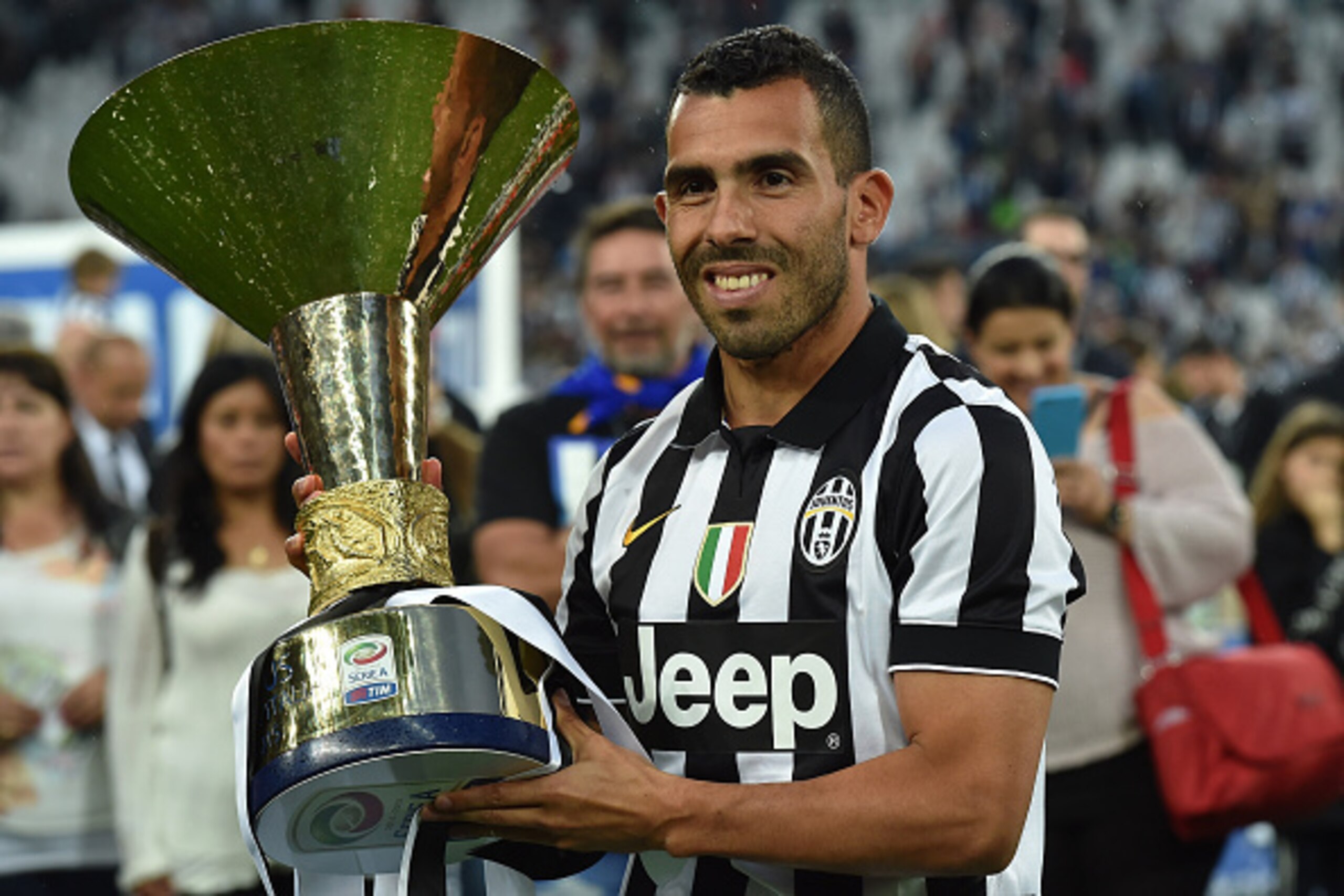 TURIN, ITALY - MAY 23: Carlos Tevez of Juventus FC celebrates with the Serie A Trophy at the end of the Serie A match between Juventus FC and SSC Napoli at Juventus Arena on May 23, 2015 in Turin, Italy. (Photo by Valerio Pennicino/Getty Images) TURIN, ITALY - MAY 23: Carlos Tevez of Juventus FC celebrates with the Serie A Trophy at the end of the Serie A match between Juventus FC and SSC Napoli at Juventus Arena on May 23, 2015 in Turin, Italy. (Photo by Valerio Pennicino/Getty Images)