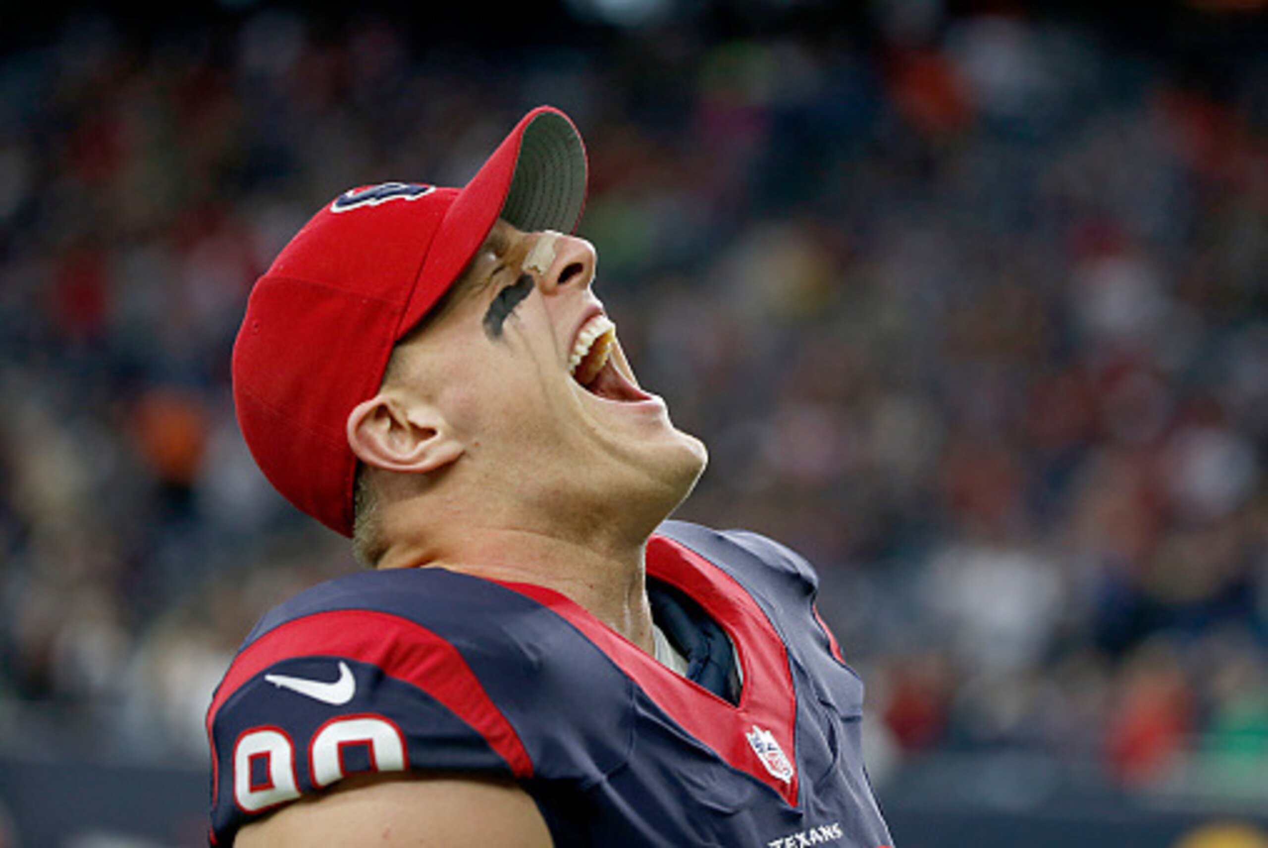 HOUSTON, TX - DECEMBER 28: J.J. Watt #99 of the Houston Texans screams before playing the Jacksonville Jaguars in a NFL game on December 28, 2014 at NRG Stadium in Houston, Texas. (Photo by Scott Halleran/Getty Images)