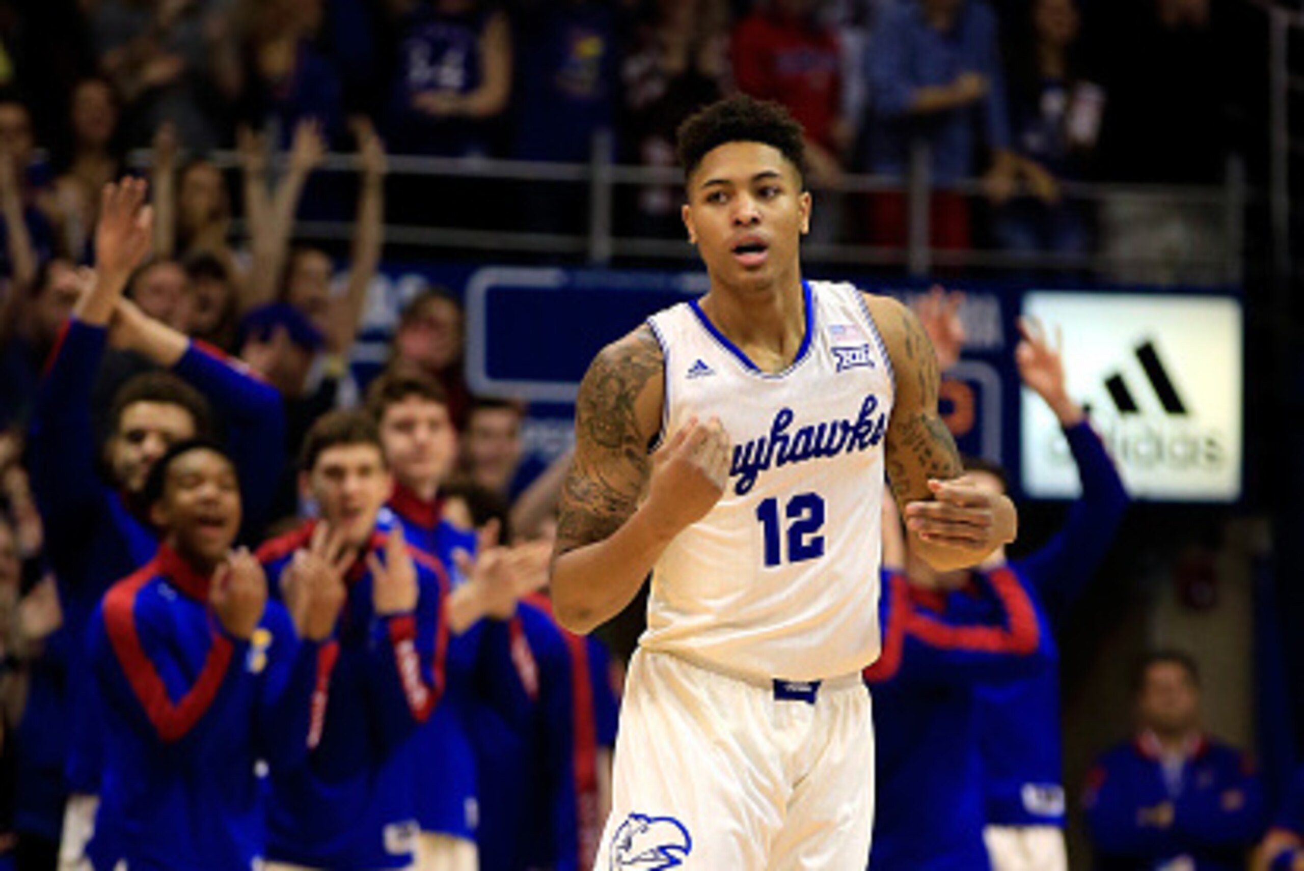 LAWRENCE, KS - JANUARY 19:  Kelly Oubre Jr. #12 of the Kansas Jayhawks reacts after sinking a three-pointer during the game against the Oklahoma Sooners at Allen Fieldhouse on January 19, 2015 in Lawrence, Kansas.  (Photo by Jamie Squire/Getty Images)