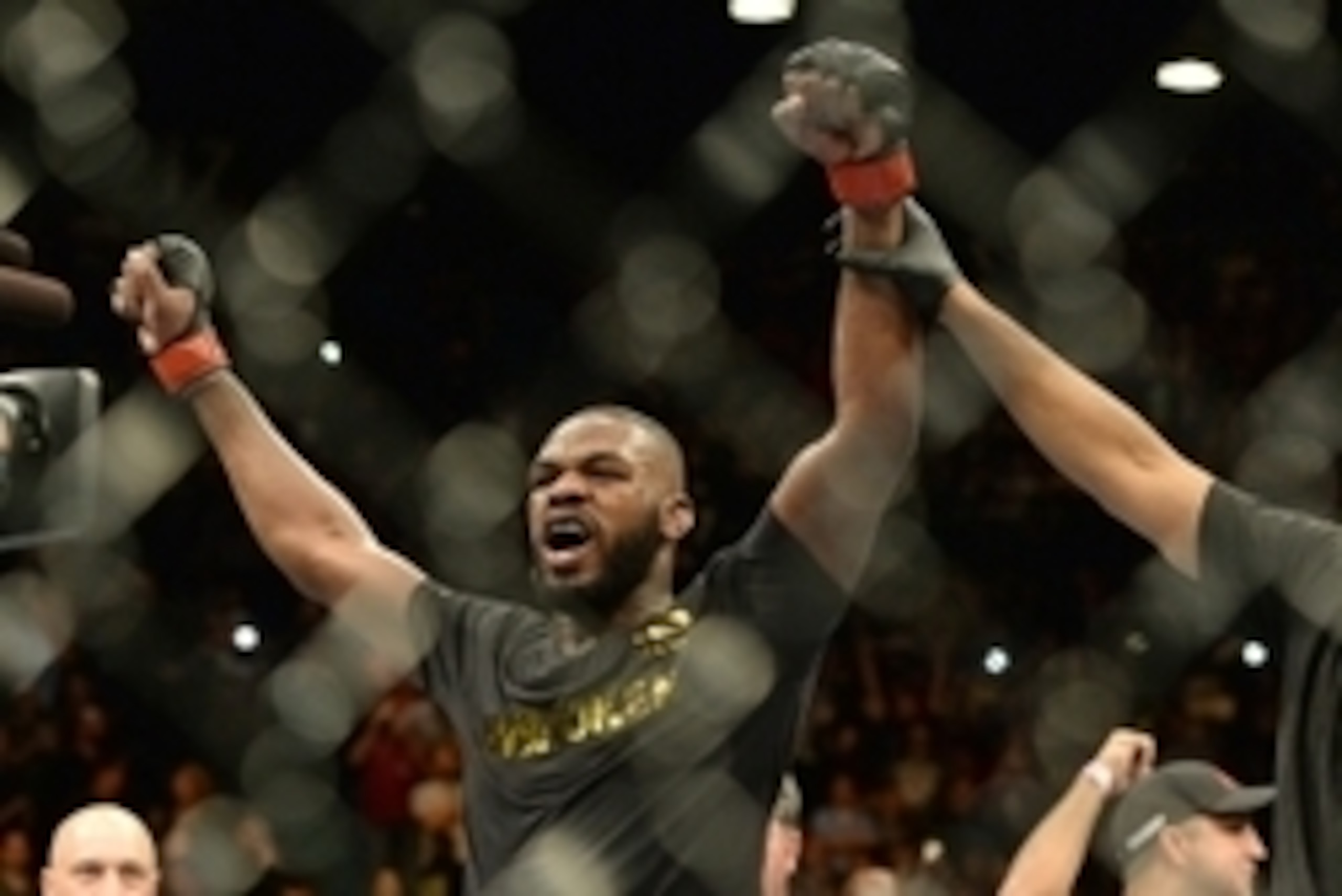 Jan 3, 2015; Las Vegas, NV, USA; Jon Jones (red gloves) celebrates after defeating Daniel Cormier (not pictured) in their light heavyweight title fight at UFC 182 at the MGM Grand Garden Arena. Jones won. Mandatory Credit: Jayne Kamin-Oncea-USA TODAY Spor