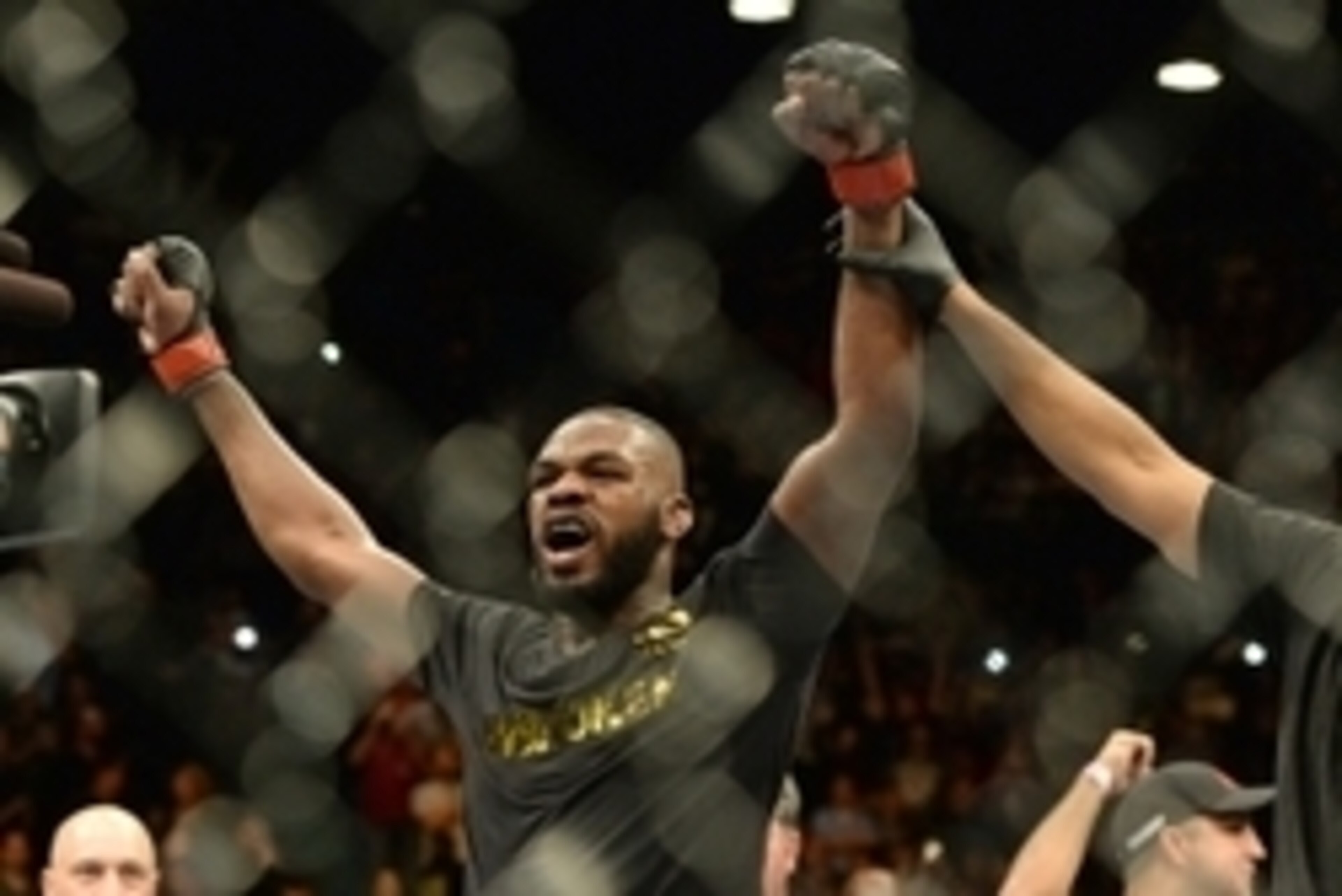 Jan 3, 2015; Las Vegas, NV, USA; Jon Jones (red gloves) celebrates after defeating Daniel Cormier (not pictured) in their light heavyweight title fight at UFC 182 at the MGM Grand Garden Arena. Jones won. Mandatory Credit: Jayne Kamin-Oncea-USA TODAY Spor