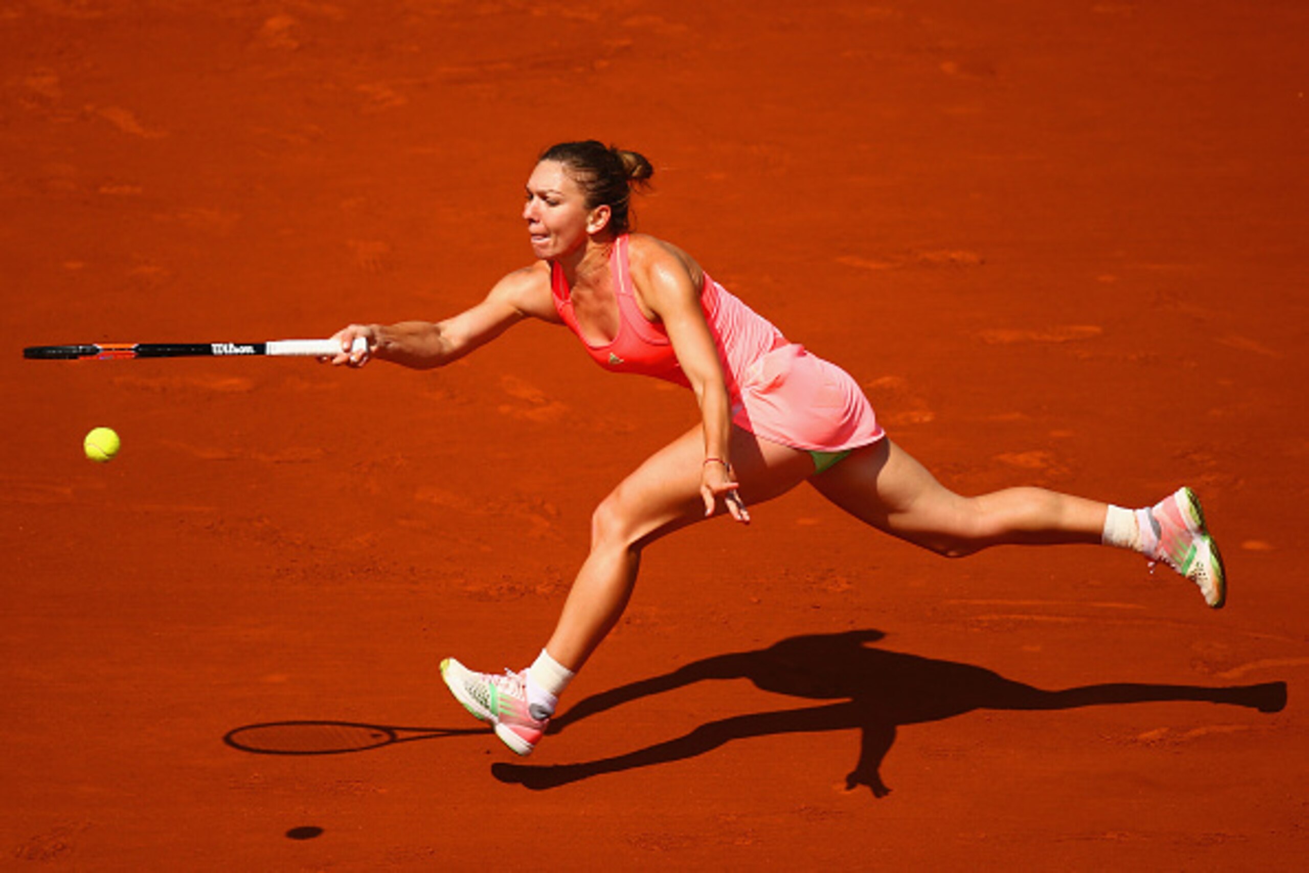 PARIS, FRANCE - MAY 27:  Simona Halep of Romania stretches in her Women's Singles match against Mirjana Lucic-Baroni of Croatia during day four of the 2015 French Open at Roland Garros on May 27, 2015 in Paris, France.  (Photo by Clive Mason/Getty Images)