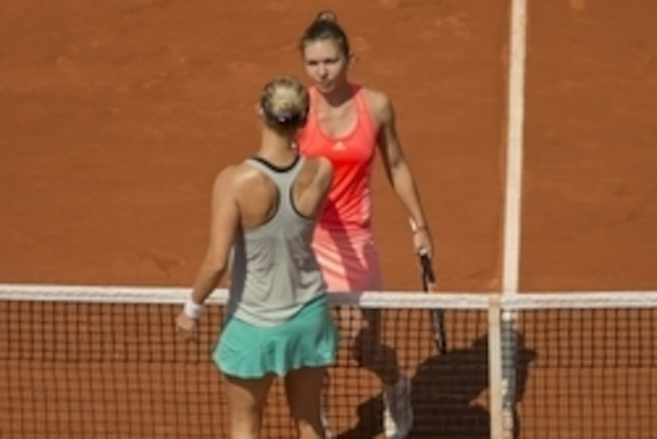 May 27, 2015; Paris, France; Mirjana Lucic-Baroni (CRO) and  Simona Halep (ROU) shake hands at the net after their match on day four of the French Open at Roland Garros. Mandatory Credit: Susan Mullane-USA TODAY Sports