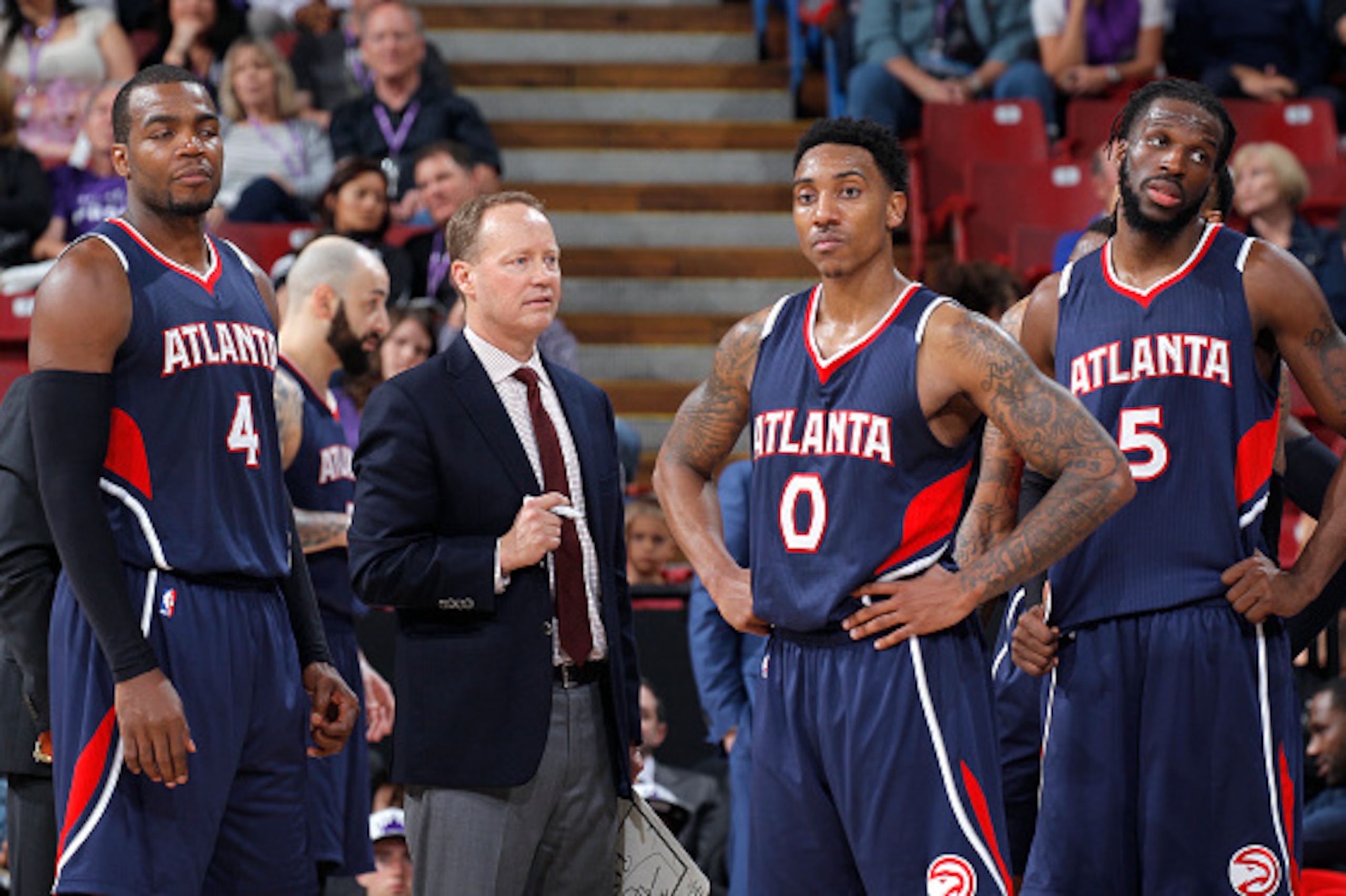 SACRAMENTO, CA - MARCH 16: Head coach Mike Budenholzer of the Atlanta Hawks coaches Paul Millsap #4 and Jeff Teague #0 against the Sacramento Kings on March 16, 2015 at Sleep Train Arena in Sacramento, California. NOTE TO USER: User expressly acknowledges